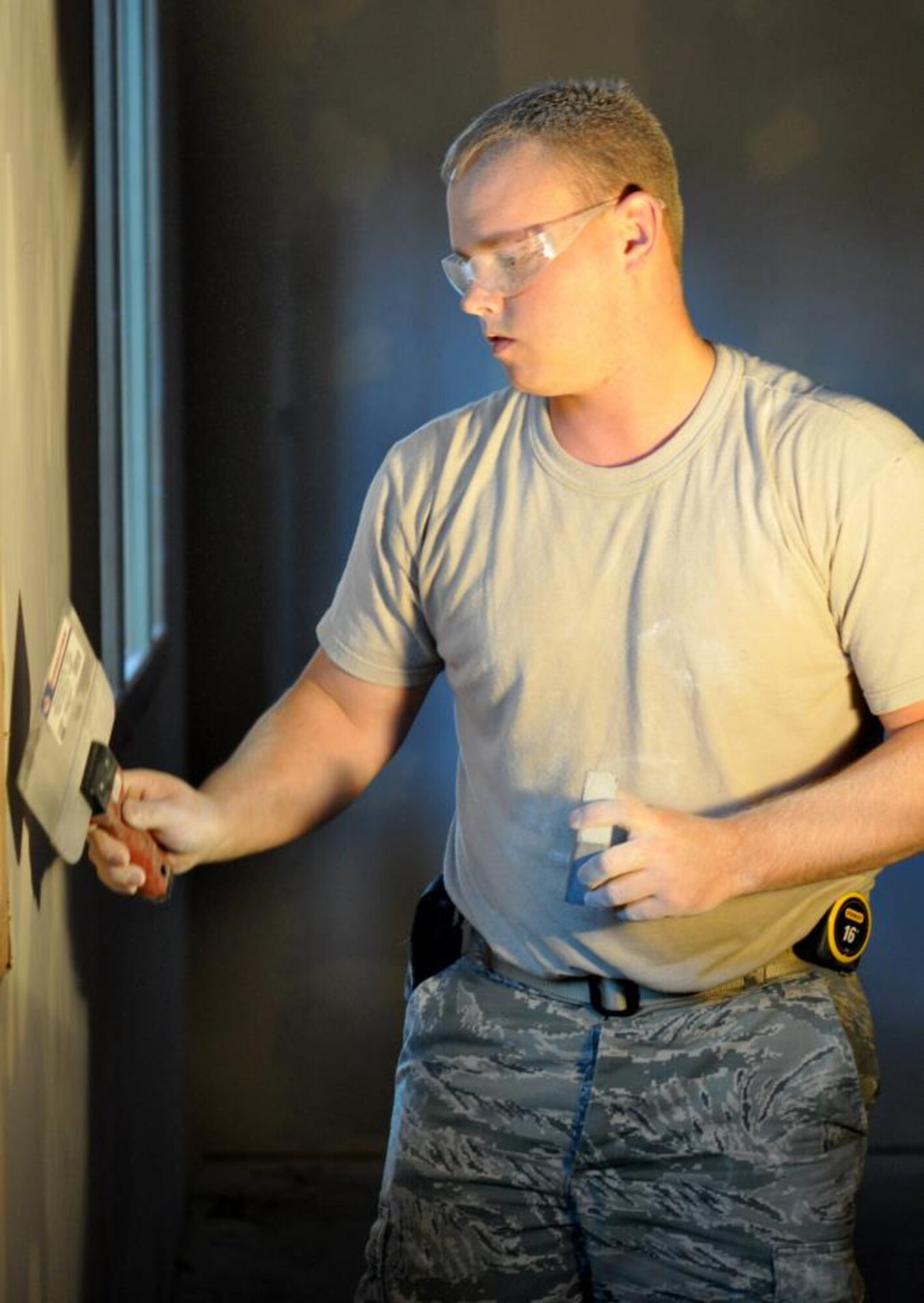 Senior Airman Shawn Levings, 442nd Civil Engineers Squadron structures technician, works on mudding drywall at a facility the squadron is helping to build while on temporary duty at RAF Mildenhall, England. The 442nd CES is part of the 442nd Fighter Wing, an A-10 Thunderbolt Air Force Reserve unit at Whiteman Air Force Base, Mo.  (U.S. Air Force photo/Staff Sgt. Danielle Johnston)