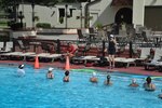 Water aerobics students at the Joint Base San Antonio-Randolph Center Pool follow along with the exercises taught by Lisa Glanzer, substitute instructor, June 20. (U.S. Air Force photo by Airman 1st Class Lincoln Korver)