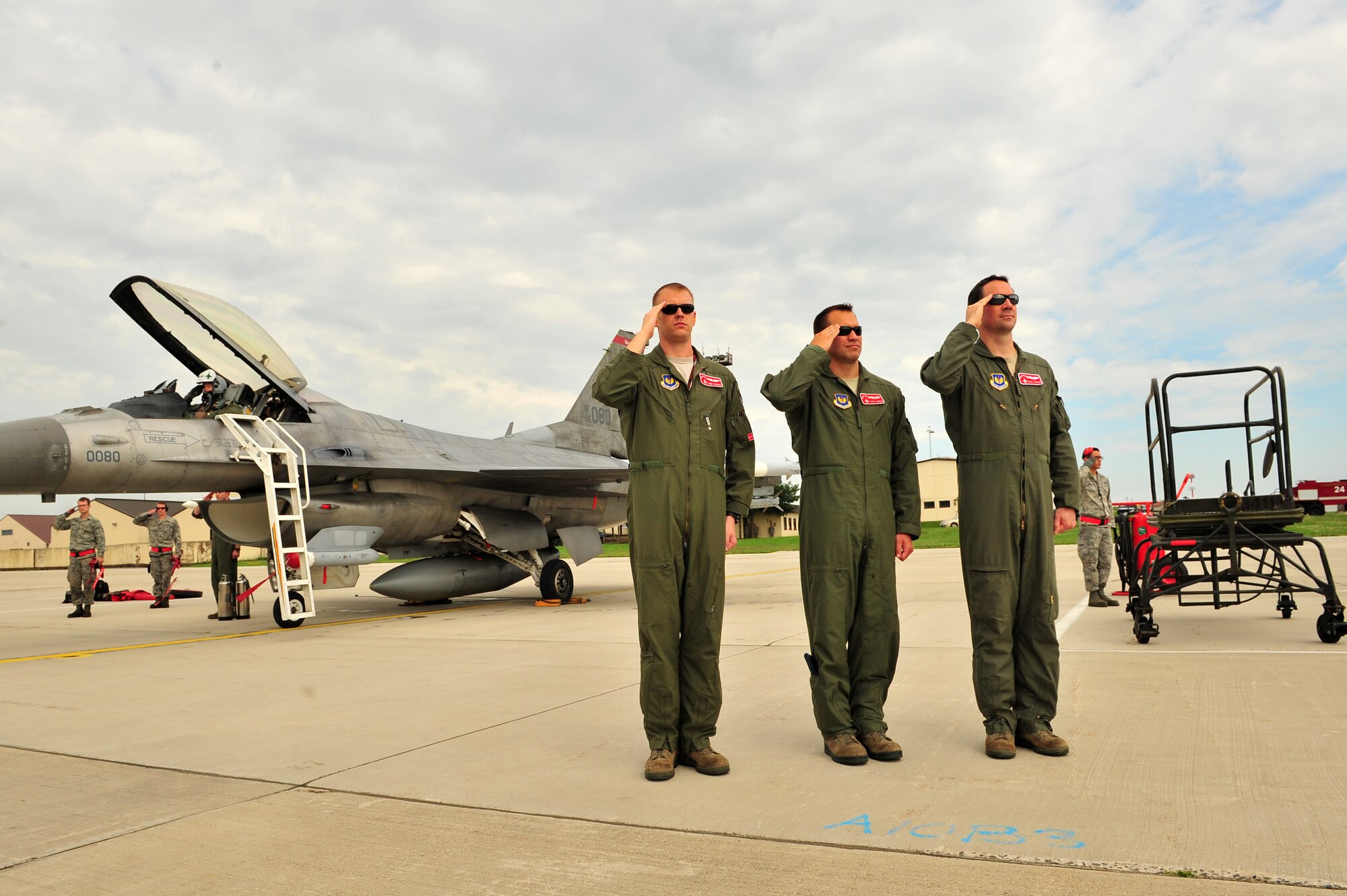 SPANGDAHLEM AIR BASE, Germany – Airmen from the 52nd Fighter Wing salute during the playing of the German and American national anthems upon arrival of Brig. Gen. Chris Weggeman, 52nd Fighter Wing commander, here June 21. Weggeman commanded the 52nd FW for two years. (U.S. Air Force photo by Airman 1st Class Dillon Davis/Released)