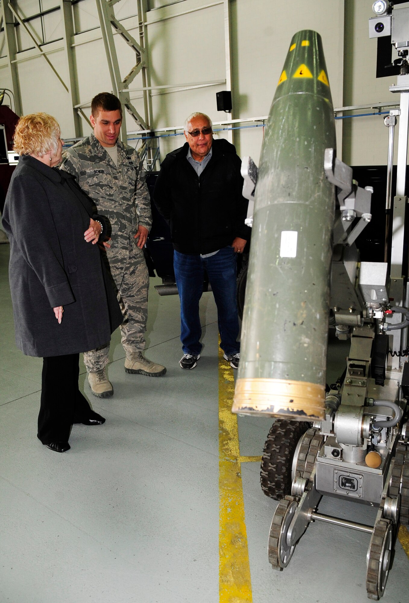 RAF MILDENHALL, England – Airman 1st Class Nick Scheer, 48th Civil Engineer Squadron Explosive Ordinance Disposal, explains the capabilities of an EOD robot to Linda and Larry Budar during the Retiree Appreciation Day event at RAF Mildenhall June 22, 2012. Linda and Larry were part of a group of more than 170 people who attended the event and had the chance to see a static KC-135 Stratotanker, military working dog demonstration, and other units from around the base. (U.S. Air Force photo/Senior Airman Ethan Morgan)