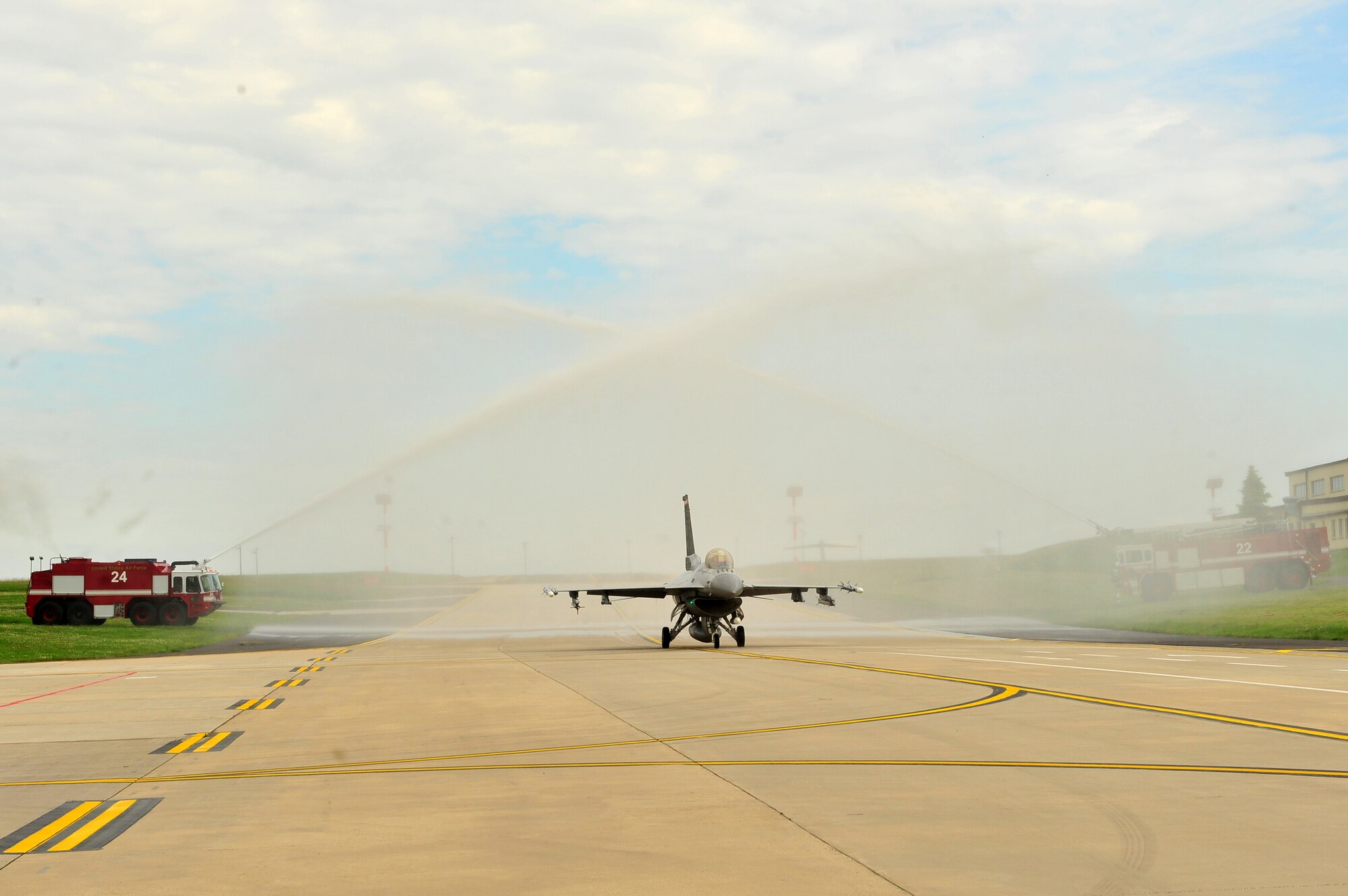 SPANGDAHLEM AIR BASE, Germany – Brig. Gen. Chris Weggeman, 52nd Fighter Wing commander, taxis an F-16 Fighting Falcon beneath two streams of water after landing his final flight here June 21. Weggeman commanded the 52nd FW for two years. (U.S. Air Force photo by Airman 1st Class Dillon Davis/Released)