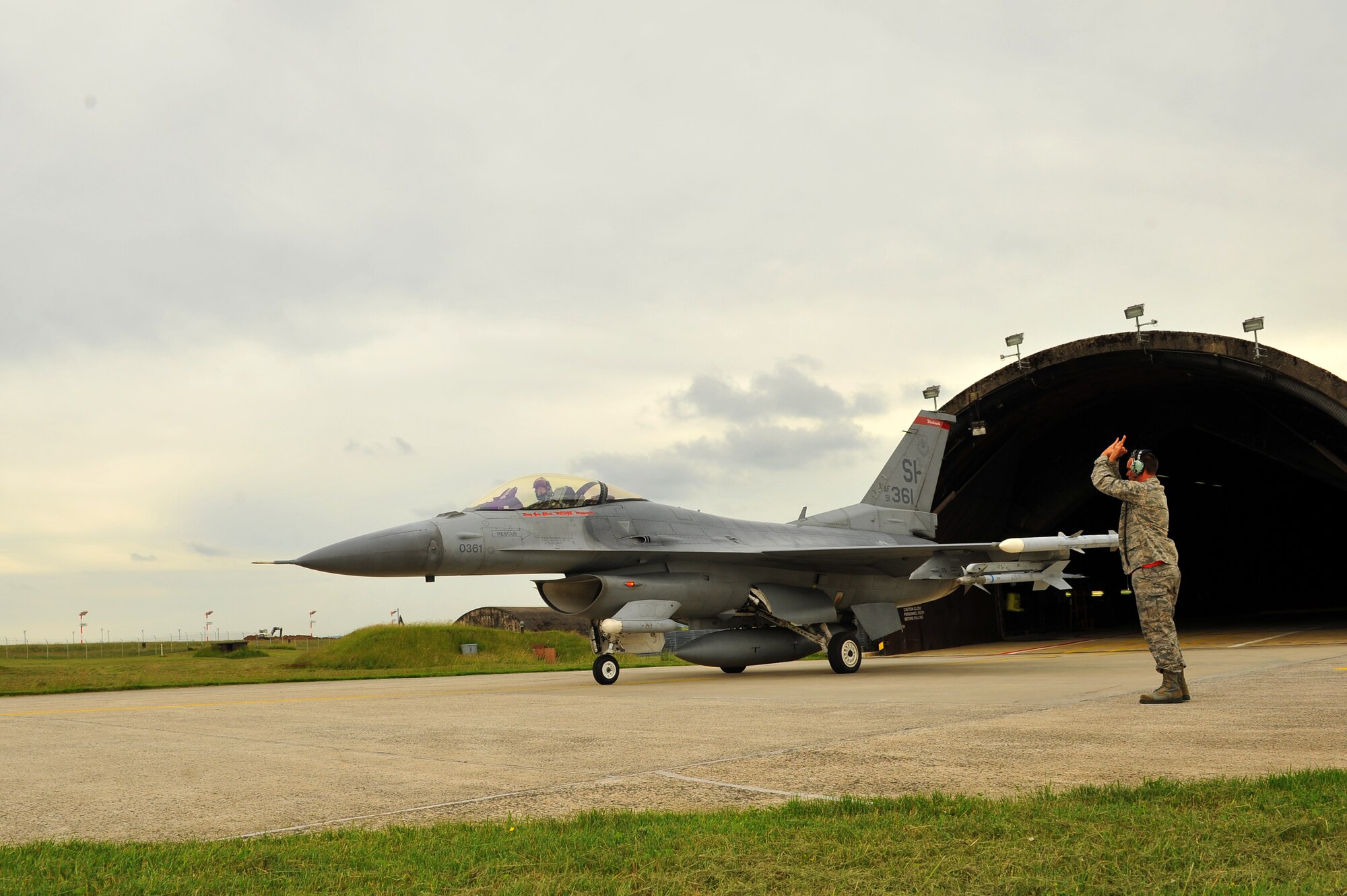 SPANGDAHLEM AIR BASE, Germany – Brig. Gen. Chris Weggeman, 52nd Fighter Wing commander, taxis an F-16 Fighting Falcon out of an aircraft shelter before his final flight here June 21. Weggeman commanded the 52nd FW for two years. (U.S. Air Force photo by Airman 1st Class Dillon Davis/Released)