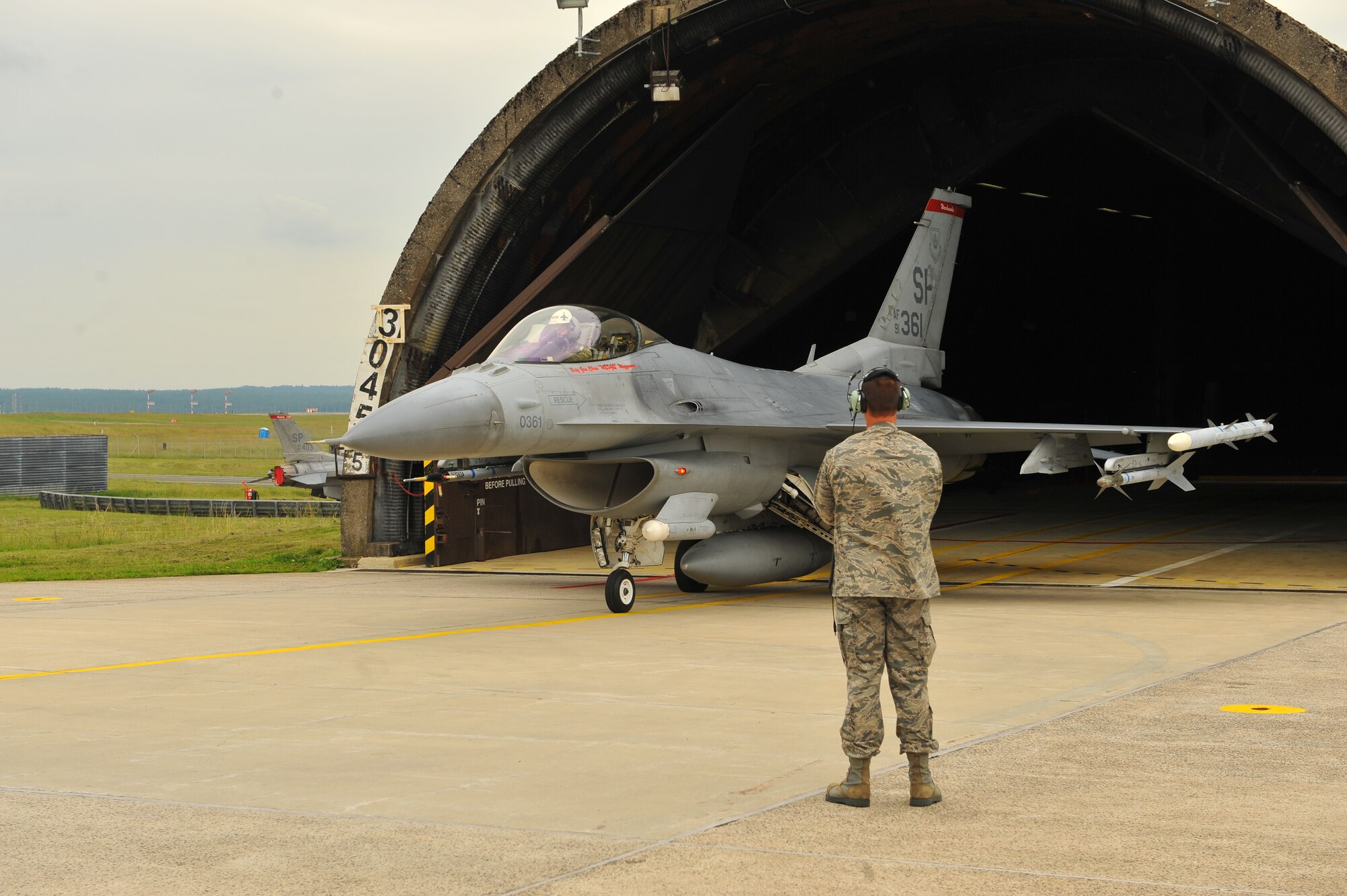 SPANGDAHLEM AIR BASE, Germany – Brig. Gen. Chris Weggeman, 52nd Fighter Wing commander, taxis an F-16 Fighting Falcon out of an aircraft shelter before his final flight here June 21. Weggeman commanded the 52nd FW for two years. (U.S. Air Force photo by Airman 1st Class Dillon Davis/Released)