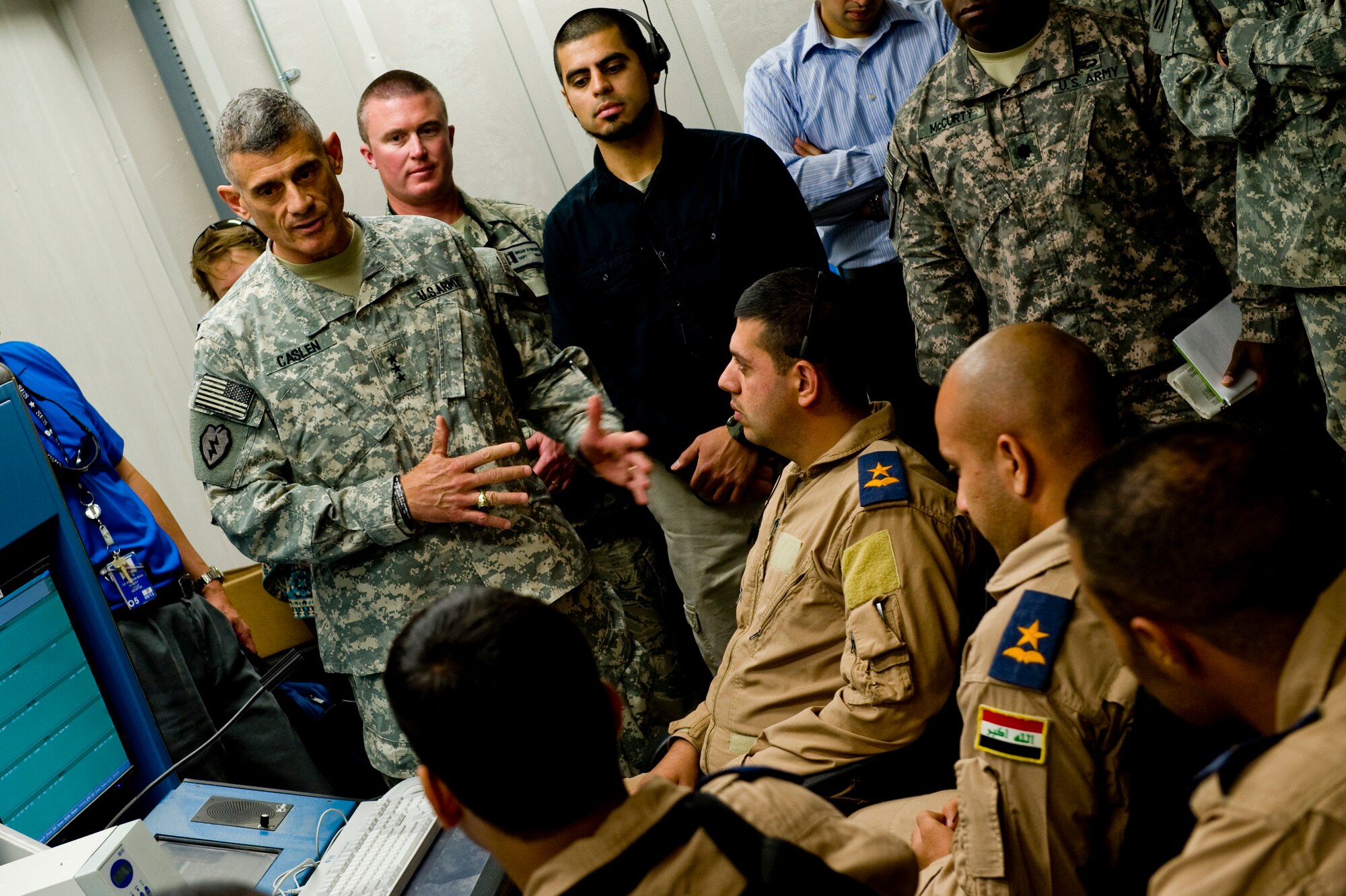 U.S. Army Lt. Gen. Robert Caslen, Office of Security Cooperation - Iraq commander, talks with Iraqi Air Traffic Control students, June 9, 2012 in Tikrit, Iraq. OSC - I in conjunction with the U.S. Embassy - Baghdad, the government of Iraq and international partners, conducts security cooperation in order to support Iraq's continued development into a sovereign stable and long-term self reliant strategic partner that contributes to peace and security in the region. (U.S. Air Force photo by Staff Sgt. Greg C. Biondo)