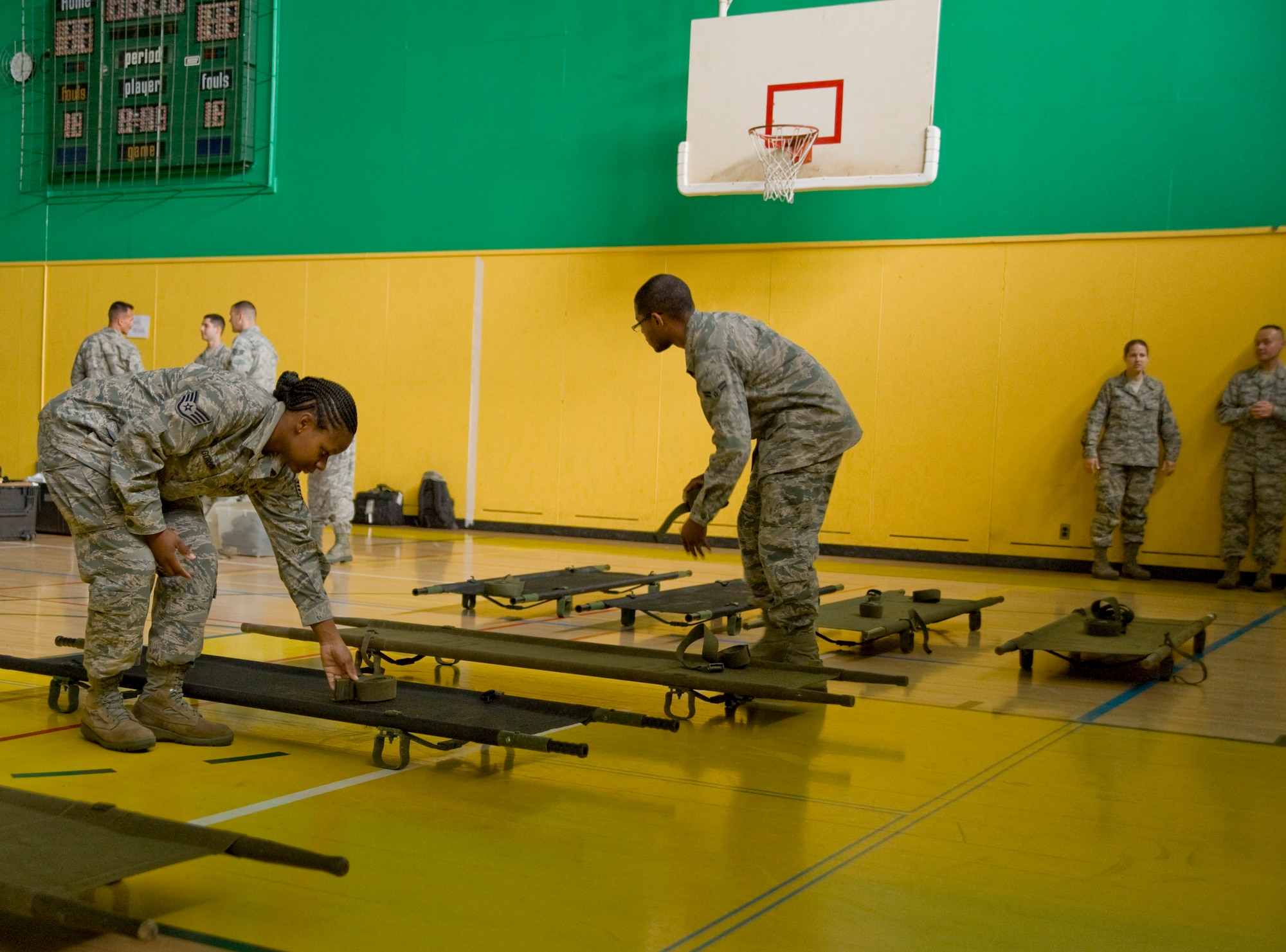 Members of the 35th Medical Group set up an alternate patient care facility at Edgren High School as part of the emergency management exercise at Misawa Air Base, Japan, June 25, 2012. During the exercise the base hospital suffered a simulated gas-induced fire that caused 35 MDG personnel to evacuate and use alternate facilities to care for patients. (U.S. Air Force photo by Staff Sgt. Nathan Lipscomb/Released)