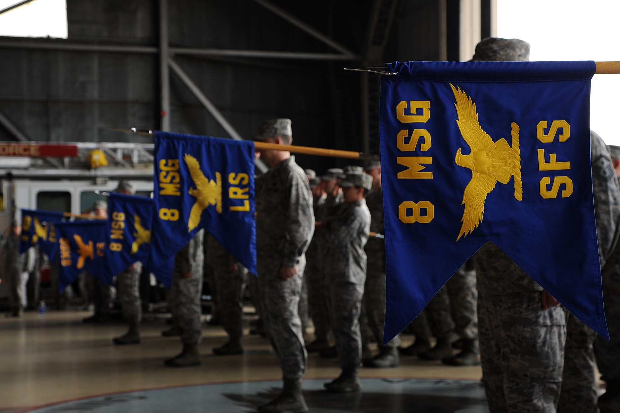 First sergeants held out their guidons representing their squadrons of the 8th Mission Support Group during the change of command ceremony on Kunsan Air Base, Republic of Korea, June 22, 2012. The military ceremony gave Airmen the chance to see Col. Joseph Atkins assume command from Col. Suzanne Kumashiro. (U.S. Air Force photo/Staff Sgt. Rasheen A. Douglas)