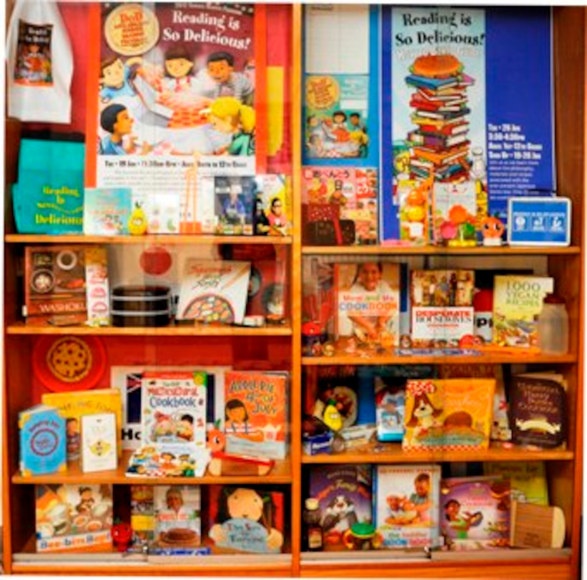 YOKOTA AIR BASE, Japan -- “Reading is so Delicious” themed books and prizes are displayed inside a case at the library at Yokota Air Base, Japan, on June 22, 2012. The books and prizes are part of the annual Department of Defense Morale, Welfare and Recreation Summer Reading Program. (U.S. Air Force photo by Senior Airman Andrea Salazar)