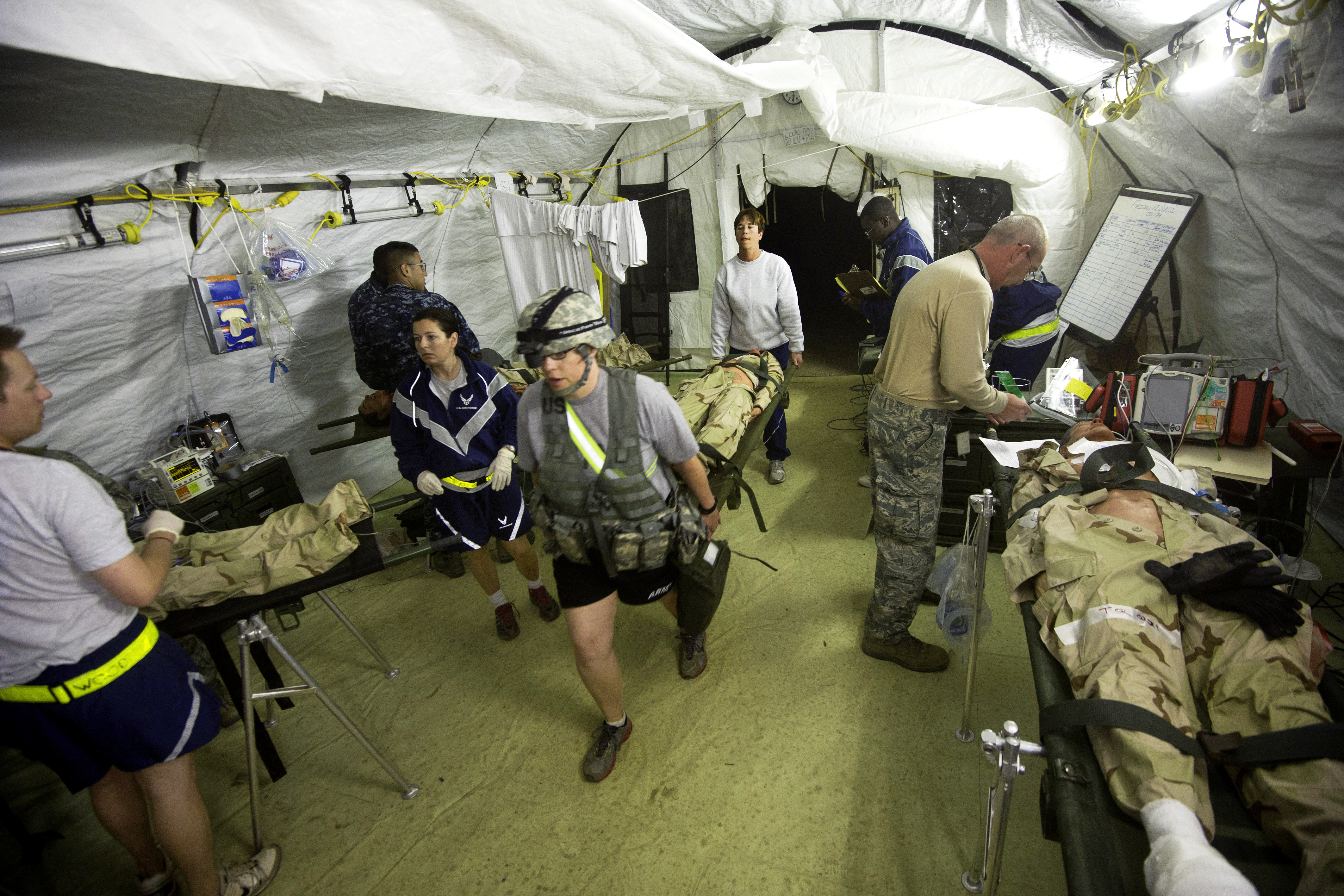 Army Air Force And Navy Medics Triage Simulated Mass Casualty Patients At A Field Hospital Located