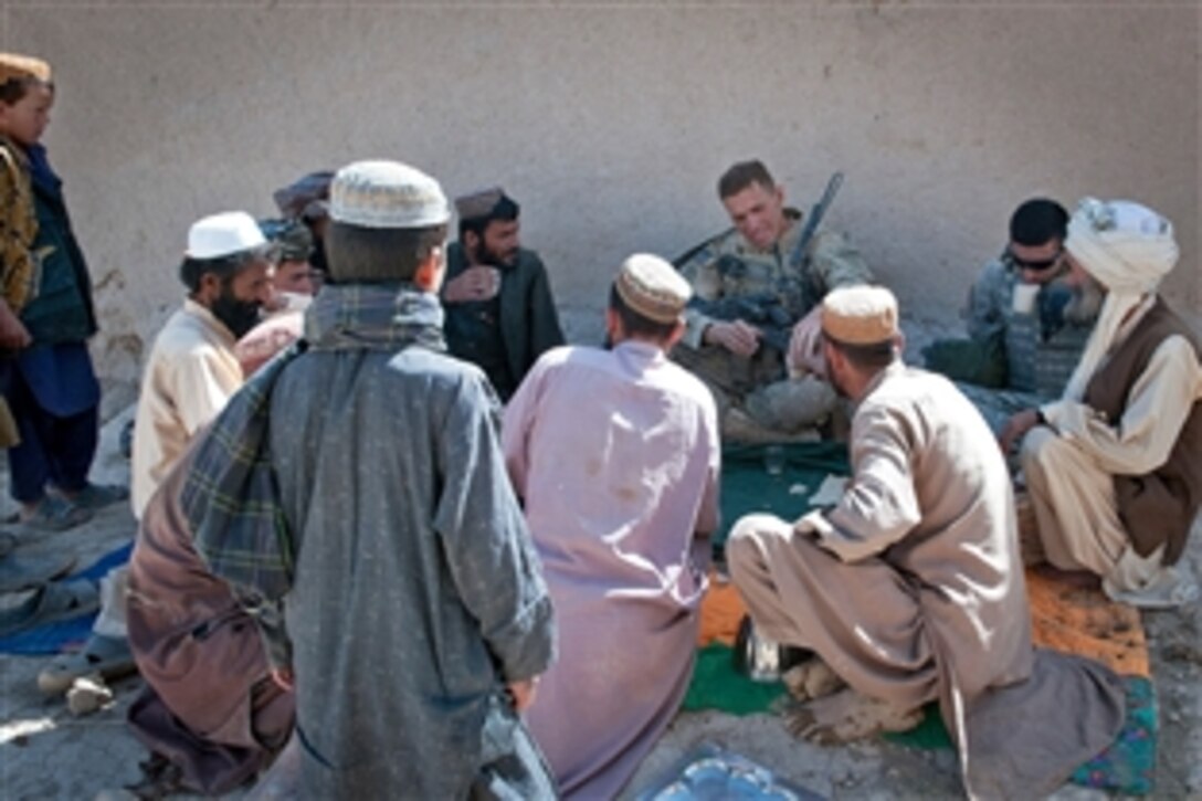 U.S. Army 1st Lt. Frederick Reier meets with villagers of Hutake in northern Afghanistan's Nawah province, June 14, 2012. Reier, a platoon leader, is assigned to the 82nd Airborne Division's 1st Battalion, 504th Parachute Infantry Regiment, 1st Brigade Combat Team. 