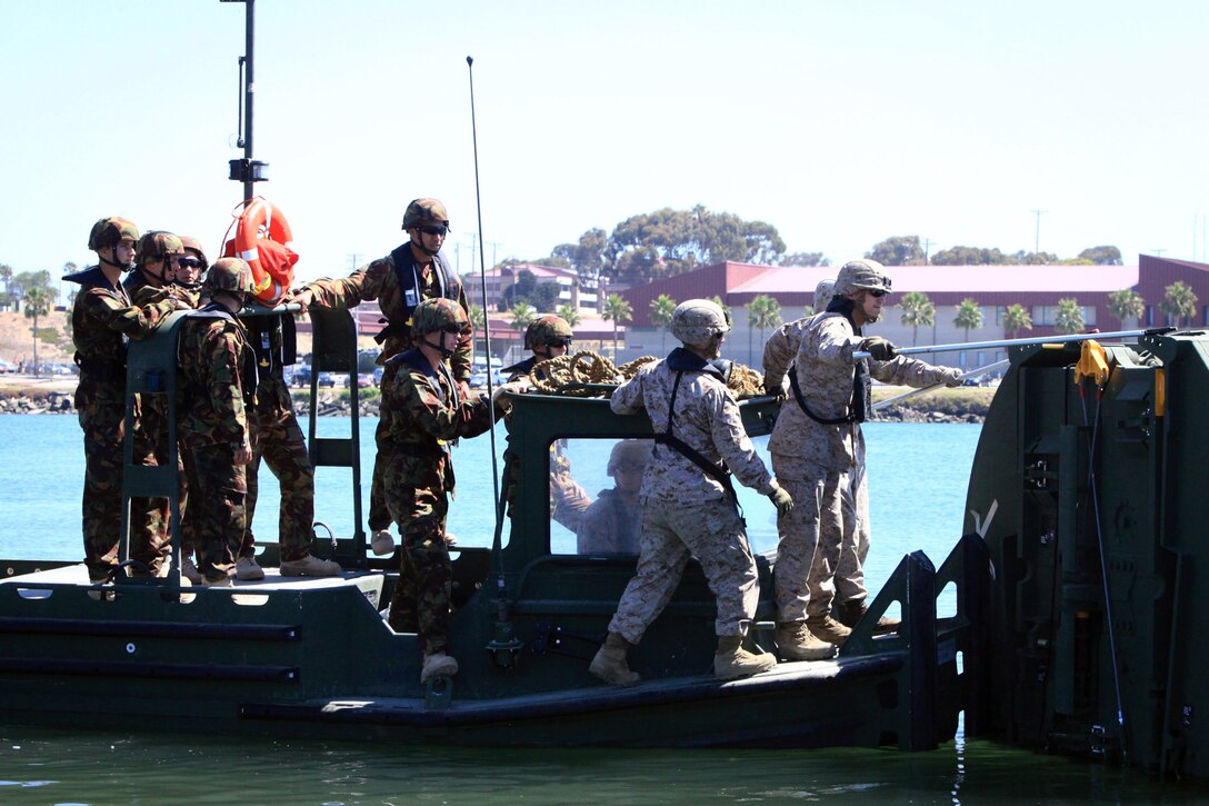Marine combat engineers with Bridge Company, 7th Engineer Support Battalion, 1st Marine Logistics Group, work with New Zealand soldiers from the Corps of Royal New Zealand Engineers to conduct improved ribbon bridge training at Camp Pendleton, Calif., June 25.  The training is part of a month-long training exercise, called Galvanic Kiwi, which afforded a military-to-military exchange.  While New Zealand soldiers train with Marines at Camp Pendleton and 29 Palms, Marines with 11th Marine Regiment, 1st Marine Division, deployed to New Zealand to conduct joint training operations.
Galvanic Kiwi is a U.S. Marine Corps and New Zealand Army training exchange designed to enhance interoperability and foster military-to-military relations between the U.S. and New Zealand.