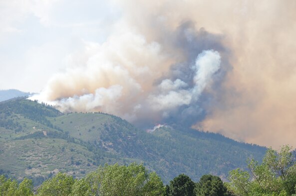 Smoke from the Waldo Canyon fire can be seen at nearby Coronado High School in western Colorado Springs, Colo.  Worsening fire conditions prompted National Forest Service officials to re-evaluate the utilization of aerial resources. (U.S. Air Force photo/1st Lt. Rusty Ridley)