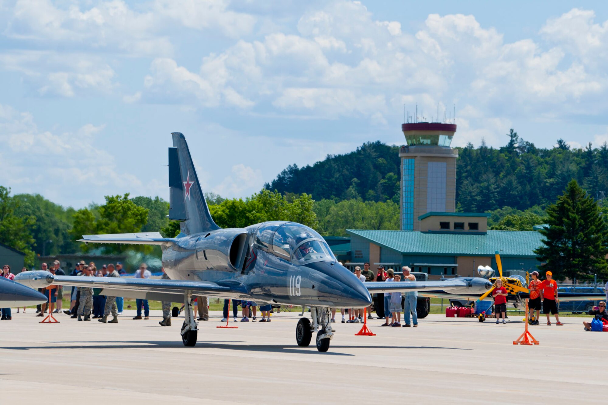 L-39 Albatross jet of the Hoppers taxis at the start of their performance with the Volk Field Control Tower in the background, June 2, 2012.  Photo by Joe Oliva, Jetpix.com