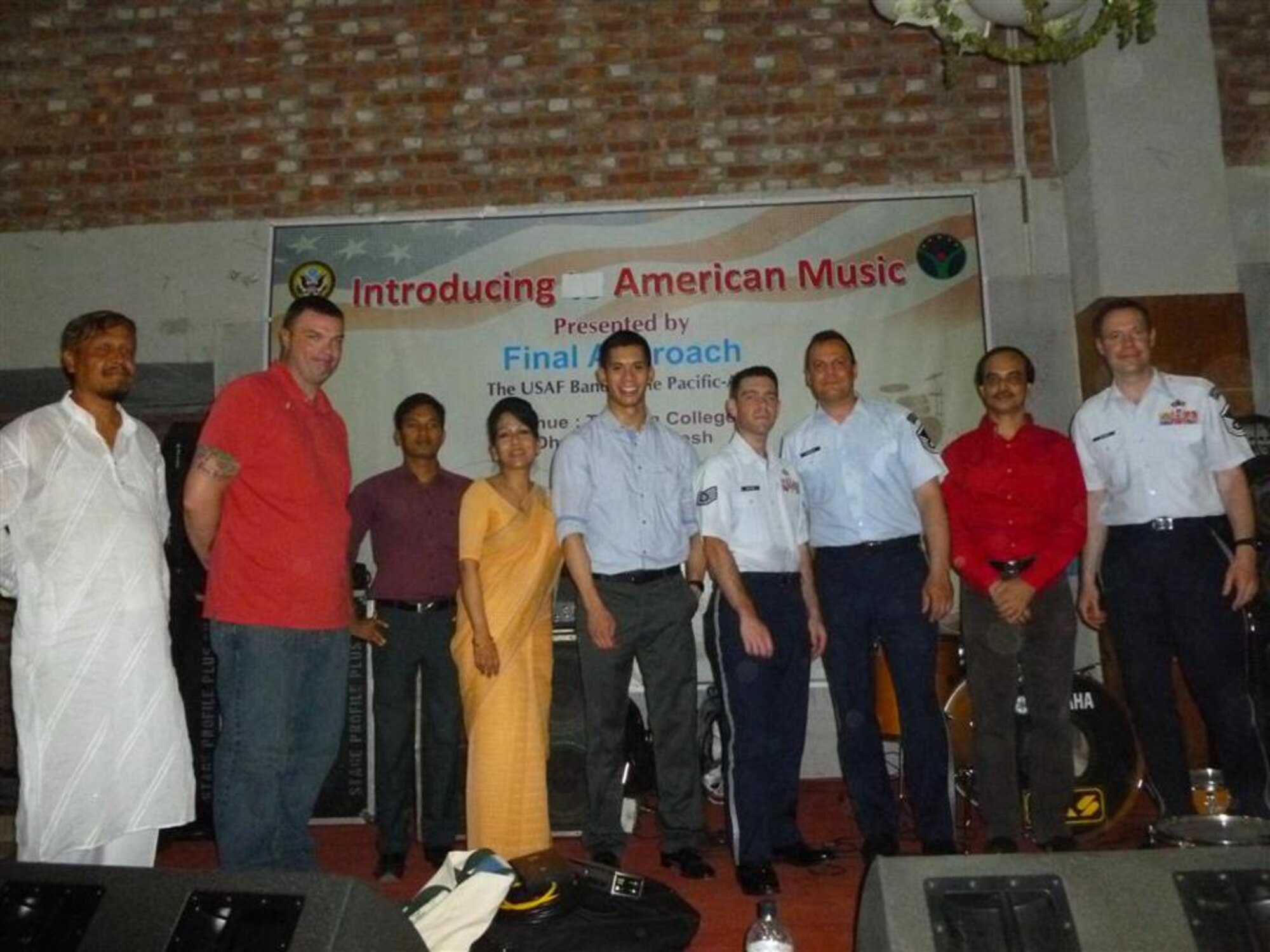 Members of Final Approach, a trio of musicians from the US Air Force Band of the Pacific-Asia pose for a picture following their performance at Tejgaon College.  The ensemble performed for over 900 dignitaries and guests for the US Embassy Dhaka's "National Day" celebration and for over 500 college students during a trip to Bangladesh.
