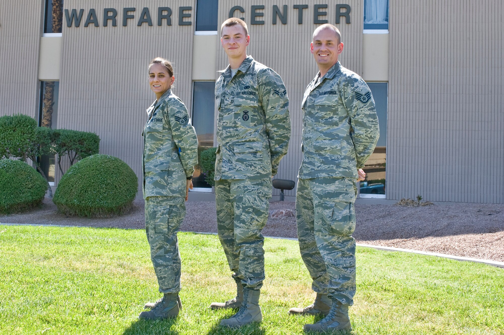 Senior Airman Heather Kelly, U.S. Air Force Warfare Center military justice paralegal, Airman1st Class Blake Wirth, 99th Security Forces Squadron elite gate guard member and patrolman, and Staff Sgt. Dustin Holmes, Public Affairs chief of photography, take a group photo after receiving the Wetzel award June 21, 2012, at Nellis Air Force Base, Nev. Each award recipient receives a $150 gift certificate to be used for dinner at one of Las Vegas? premier restaurants, tickets to Las Vegas shows, gas coupons, Station Casino gift certificates, and other gifts that vary seasonally. (U.S. Air Force photo by Airman 1st Class Matthew Lancaster)