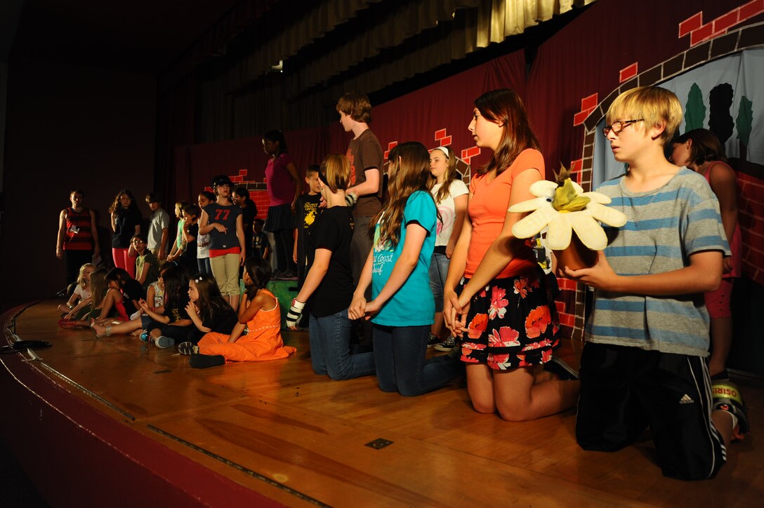 Children from the Ellsworth community rehearse for their performance of “The Secret Garden” with the Missoula Children’s Theater in the base theater at Ellsworth Air Force Base theater, S.D., June 15, 2012. The primary goal of MCT from Montana is to develop of life skills in children through participation in the performing arts. (U.S. Air Force photo by Airman 1st Class Zachary Hada, Released)
