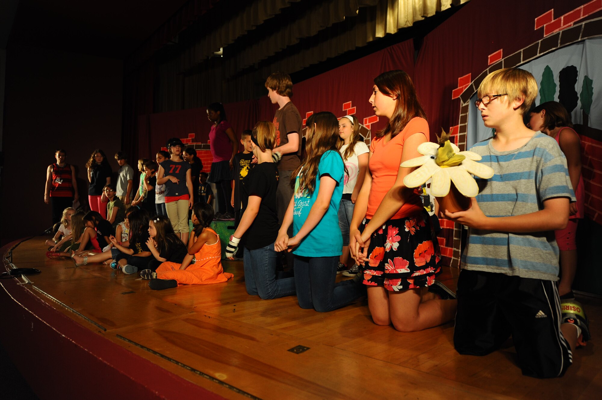 Children from the Ellsworth community rehearse for their performance of “The Secret Garden” with the Missoula Children’s Theater in the base theater at Ellsworth Air Force Base theater, S.D., June 15, 2012. The primary goal of MCT from Montana is to develop of life skills in children through participation in the performing arts. (U.S. Air Force photo by Airman 1st Class Zachary Hada, Released)