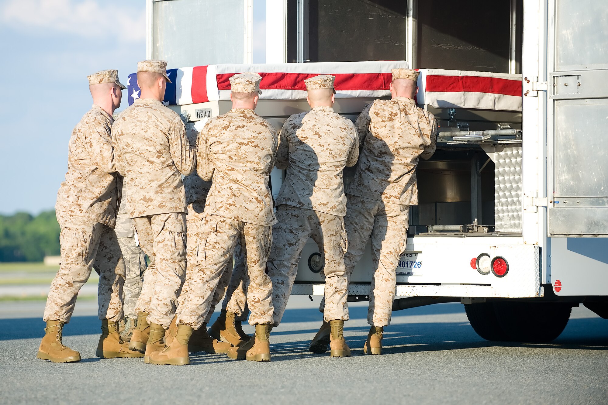 A U.S. Marine Corps carry team transfers the remains of Marine Lance Cpl. Eugene C. Mills III of Laurel, Md., at Dover Air Force Base, Del., June 25, 2012. Mills was assigned to 1st Battalion, 8th Marine Regiment, 2nd Marine Division, II Marine Expeditionary Force, Camp Lejeune, N.C. (U.S. Air Force photo/Adrian R. Rowan)
