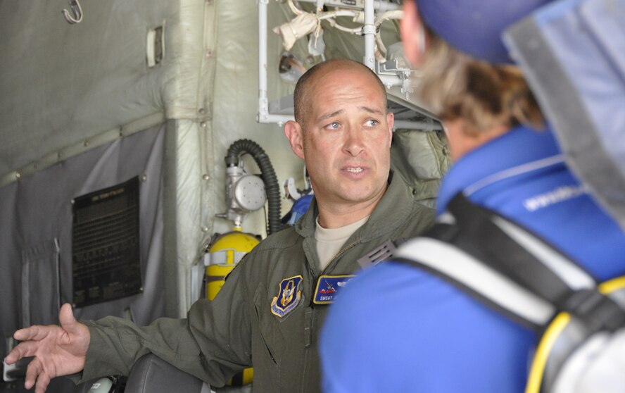 Senior Master Sgt. Jeff Flight, a MAFFS-qualified loadmaster with the 302nd Airlift Wing Reserve Command, explains how the Modular Airborne Fire Fighting System, or MAFFS, works to Colorado media outlets June 25 here.  Four MAFFS-equipped C-130 Hercules were called into service to assist with wildland fires in the Rocky Mountain area. The two planes from Peterson were joined by two Air National Guard planes from Wyoming. (U.S. Air Force photo/Tech. Sgt. Daniel Butterfield)