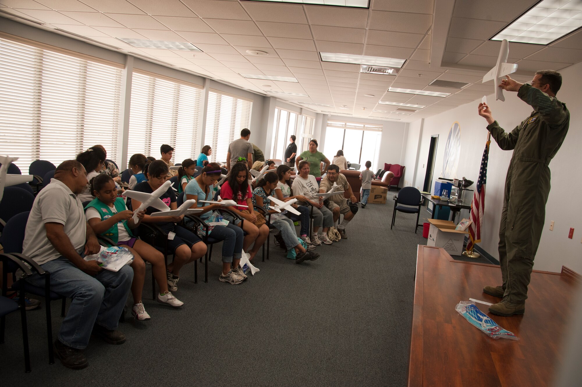 Maj. Jason Jaeger, 47th Operations Group, demonstrates how to build a model plane to a class of scouts during Scout Aviation Day at the 86th Flying Training Squadron at Laughlin Air Force Base, Texas, June 22, 2012. The day long camp offered Boy, Girl and Cub Scouts a chance to see Laughlin’s pilot training mission, learn about aviation and discover what makes flight possible. (U.S. Air Force photo/Airman 1st Class Nathan Maysonet)