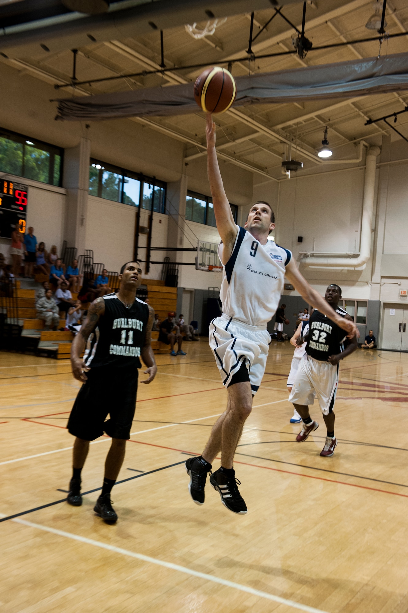 U.K. Royal Air Force Flight Lt. Chris McIntyre, a RAF team basketball player, lays-up during a basketball game against the Hurlburt Field commandos at the Aderholt Gym on Hurlburt Field, Fla., June 20, 2012. The RAF men's and women's basketball teams were on Hurlburt Field for a two-week training camp. (U.S. Air Force photo/Airman 1st Class Christopher Williams)(Released)