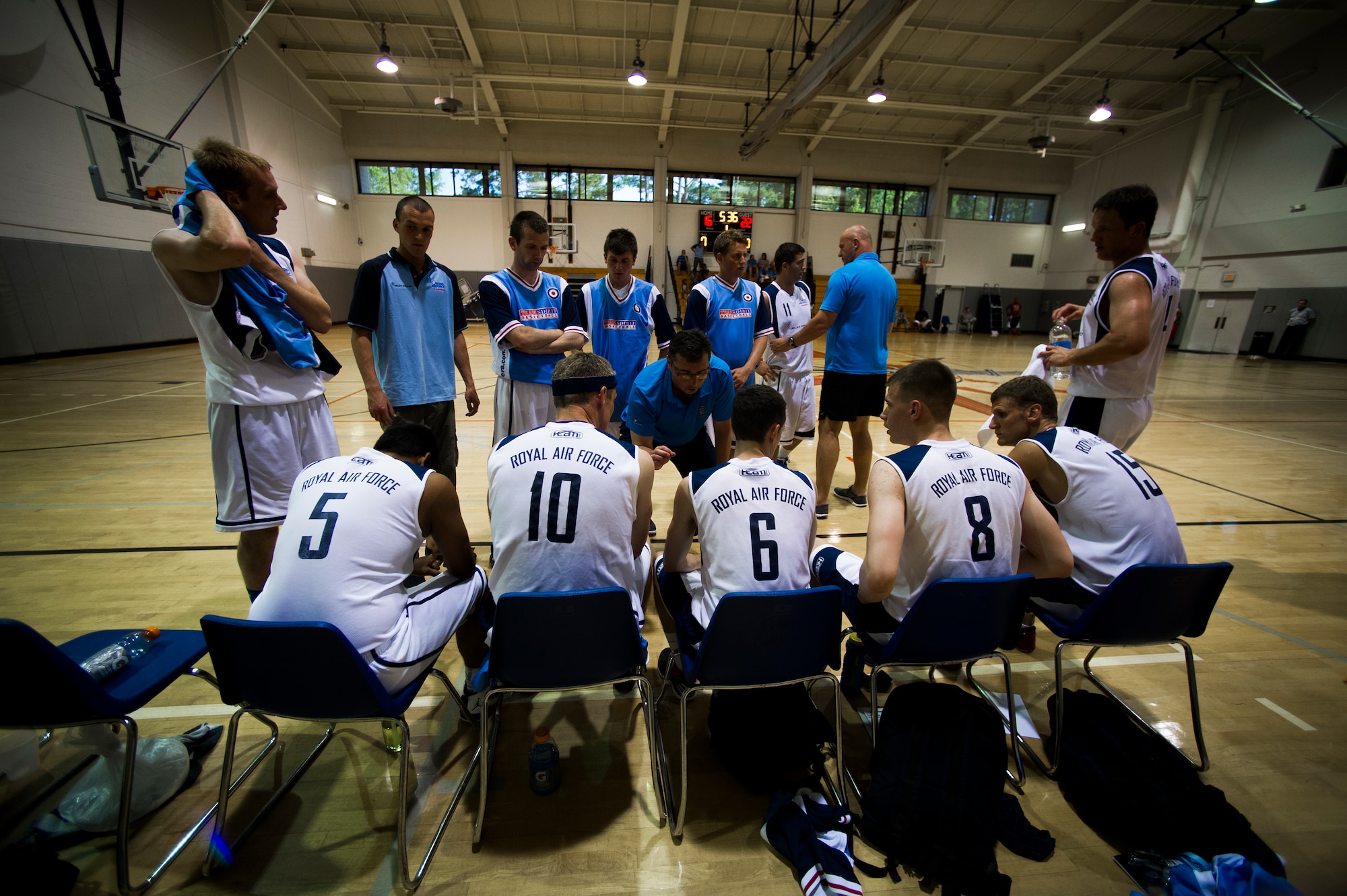 U.K. Royal Air Force Flight Lt. Richie Weeks, coach of the RAF basketball team, talks to his team during a timeout at the Aderholt Gym on Hurlburt Field, Fla., June 20, 2012. The RAF basketball teams traveled to Hurlburt Field for a two-week training camp. (U.S. Air Force photo by Airman 1st Class Christopher Williams) (RELEASED)