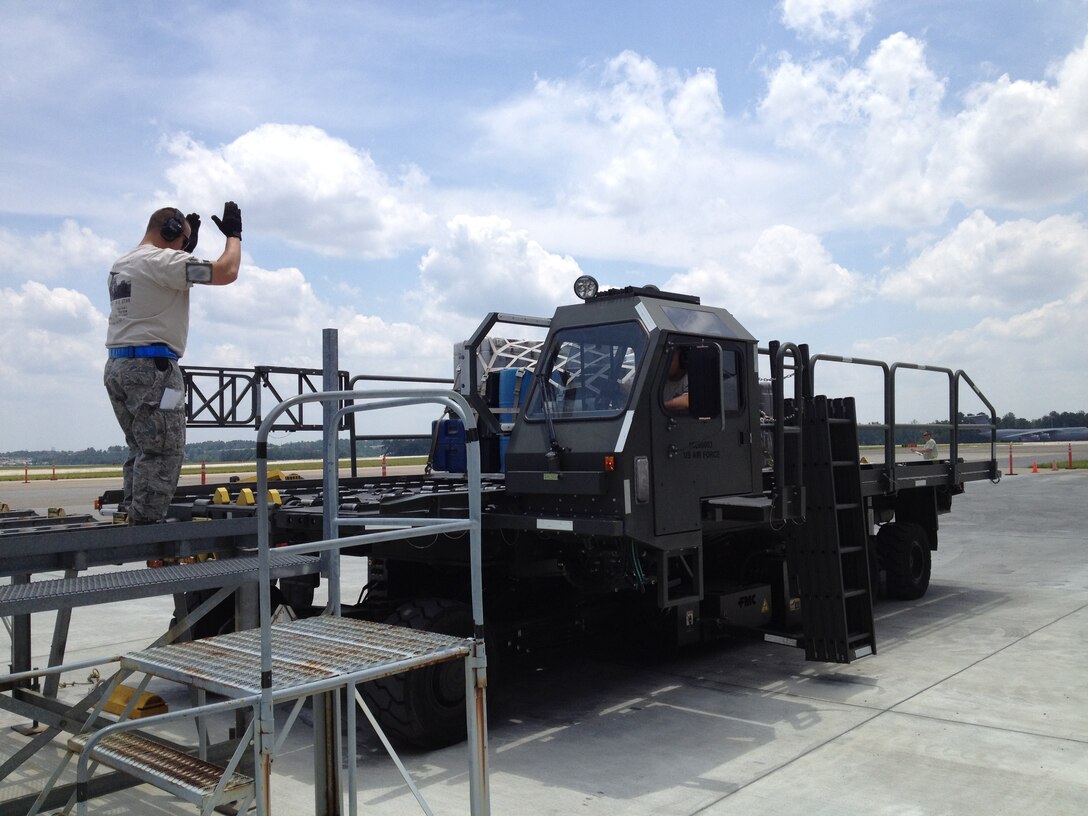 Master Sgt. Brandon De Los Reyes, 67th Aerial Port Squadron, lines up the loading docks so the team can safely load and unload cargo from the aircraft. The team completed three days of competitions designed to test knowledge and skills unique to their career field. (Courtesy photo)