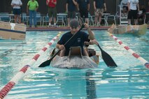 U.S. Air Force Airmen race in cardboard boats during the First Annual Build a Boat competition at Moody Air Force Base Ga., June 21, 2012. The competition had three categories; fastest time won by the 23d Operation Support Squadron, first to sink won by the 723d Aircraft Maintenance Squadron and most decorative won by the 23d Aircraft Maintenance Squadron. (U.S. Air Force photo by Airman 1st Class Paul Francis/Released)
