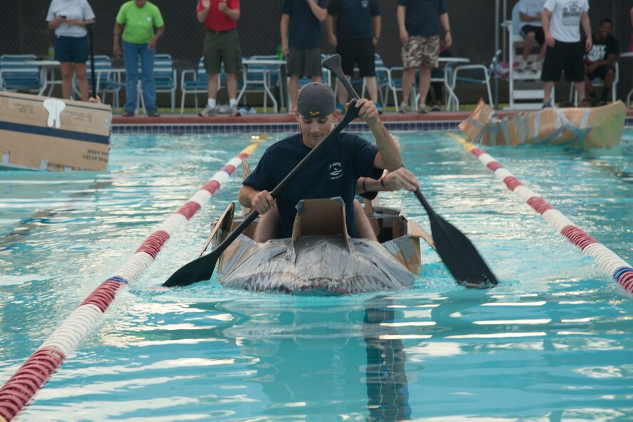 U.S. Air Force Airmen race in cardboard boats during the First Annual Build a Boat competition at Moody Air Force Base Ga., June 21, 2012. The competition had three categories; fastest time won by the 23d Operation Support Squadron, first to sink won by the 723d Aircraft Maintenance Squadron and most decorative won by the 23d Aircraft Maintenance Squadron. (U.S. Air Force photo by Airman 1st Class Paul Francis/Released)
