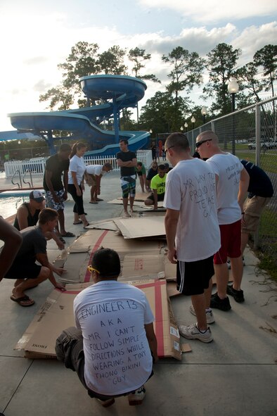 U.S. Air Force Airmen compete in the First Annual Build a Boat competition at Moody Air Force Base Ga., June 21, 2012. Teams of five had five minutes to collect materials, game plan, and think about their approach before the competition began. (U.S. Air Force photo by Airman 1st Class Paul Francis/Released)