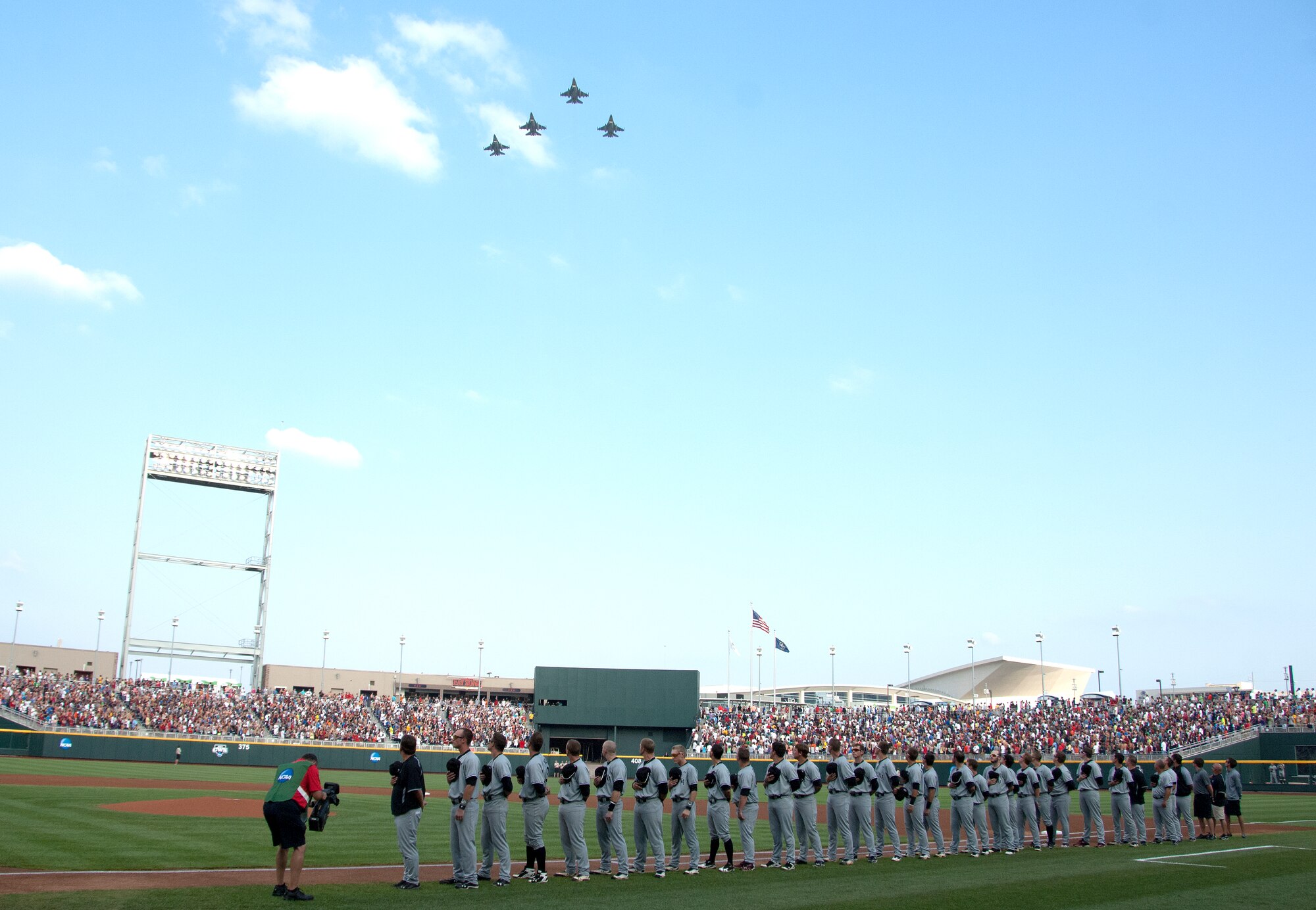 A formation of F-16 fighter jets perform a flyover demonstration prior to game one of the 2012 College World Series championship series held TD Ameritrade Park in downtown Omaha, Neb., June 24. The University of Arizona went on to defeat the University of South Carolina to win the 2012 College World Series. (U.S. Air Force photo by Delanie Stafford/Released)