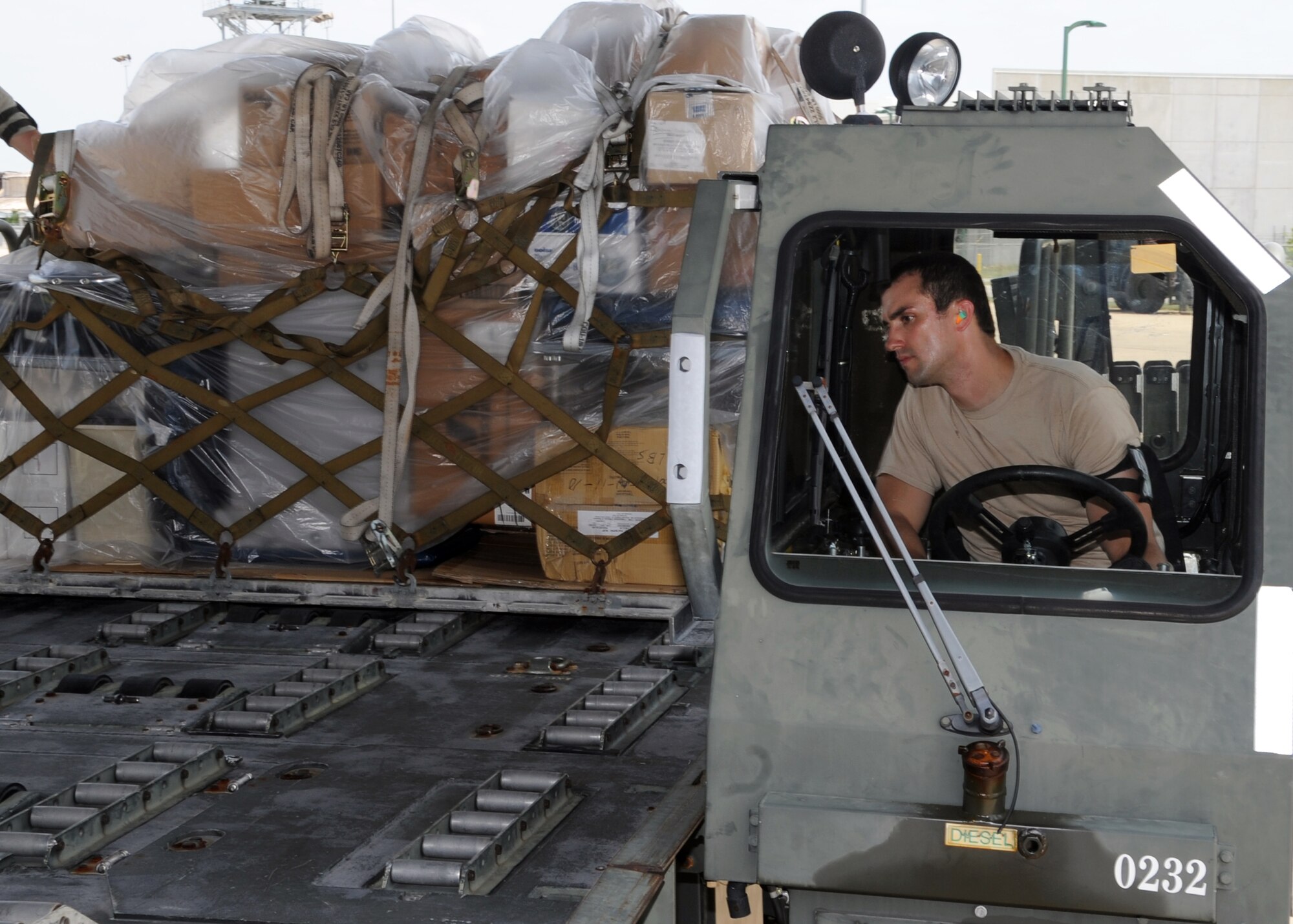 GULFPORT AIR NATIONAL GUARD BASE, Miss. – Tech. Sgt. Richard House, 81st Logistics Readiness Squadron air transportation specialist, Keesler Air Force Base, Miss., operates a Next Generation System Loader to place a pallet of medical supplies on an Altus AFB C-17 Globemaster III, June 22, 2012. Altus AFB picked up medical supplies at the Gulfport ANG, then delivered them to Haiti for Operation Ukraine, the organization that donated the supplies. (U.S. Air Force photo by Airman 1st Class Franklin R. Ramos / 97th Air Mobility Wing / Released)