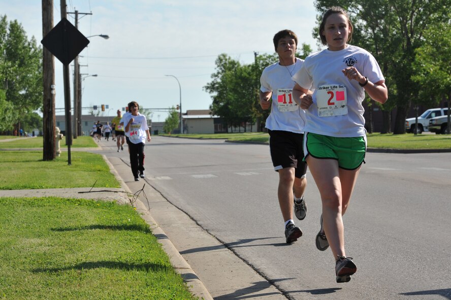 MINOT AIR FORCE BASE, N.D. -- Airmen and their families participate in the Air Force Global Strike Command Striker Life Half Marathon, 10K and 5K here June 23. The first-ever command-wide half marathon series started this spring and will end this summer. This event is part of an effort to promote physical fitness and encourage goal-setting by Airmen. (U.S. Air Force photo/Senior Airman Brittany Y. Auld)