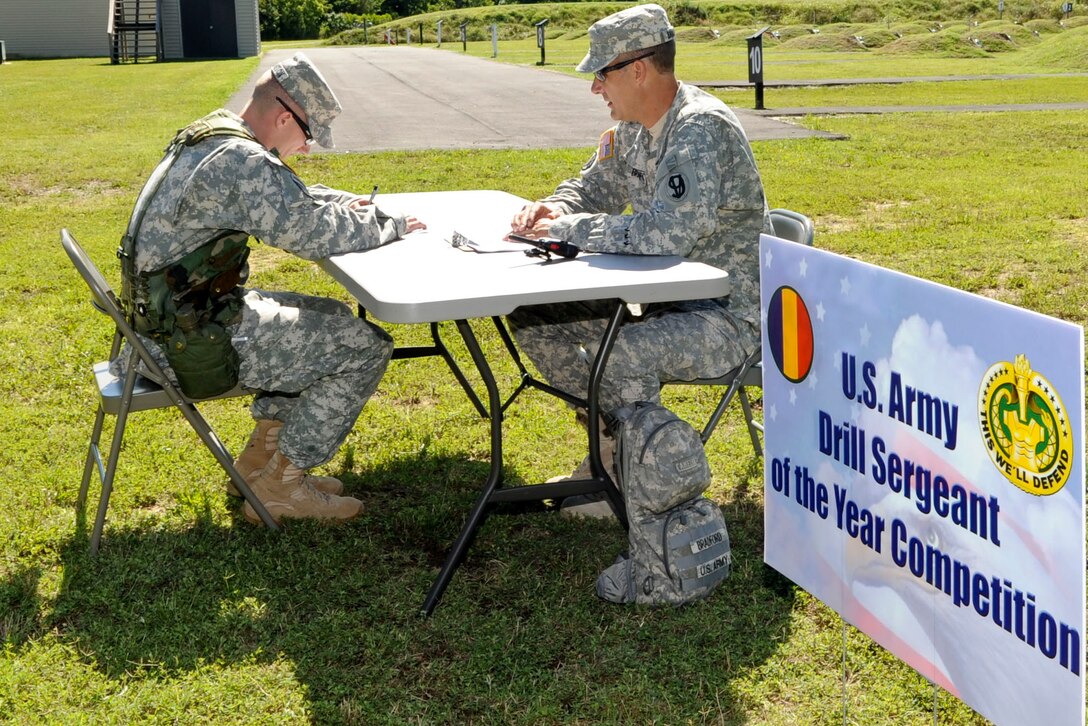 U.S. Army Sgt. 1st Class Adam McQuiston, Fort Leonard Wood, Mo., drill instructor, takes a Drill Sergeant History test as part of the annual week-long Drill Sergeant of the Year event, hosted by Initial Military Training, U.S. Army Training and Doctrine Command, June 26, 2012, at Fort Eustis, Va. During the event six drill sergeants competed in a variety of mental and physical event for the title of Drill Sergeant of the Year. (U.S. Air Force photo by Senior Airman Wesley Farnsworth/Released)