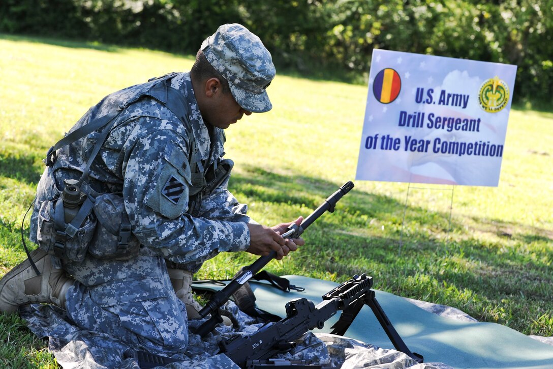 U.S. Army Staff Sgt. Victor Marquez-Rodriguez Sr., Fort Sill, Okla., drill sergeant, puts together a M-240B Machine Gun during a timed event of the annual Drill Sergeant of the Year competition, June 26, 2012, at Fort Eustis, Va. Marquez-Rodriguez is one of six drill sergeants competing in the weeklong competition, hosted by Initial Military Training, U.S. Army Training and Doctrine Command, to determine who wins the title. (U.S. Air Force photo by Senior Airman Wesley Farnsworth/Released) 