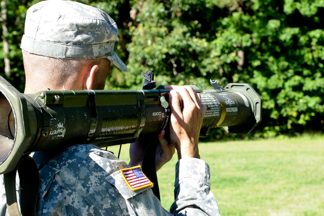 U.S. Army Staff Sgt. Jarod Moss, 95th Reserve Division drill sergeant, demonstrates how to function check a M-136 Rocket Launcher, during the annual week-long Drill Sergeant of the Year event, hosted by Initial Military Training, U.S. Army Training and Doctrine Command, June 26, 2012, at Fort Eustis, Va. Moss is one of six drill sergeants competing in a variety of mental and physical event for the title of Drill Sergeant of the Year. (U.S. Air Force photo by Senior Airman Wesley Farnsworth/Released)