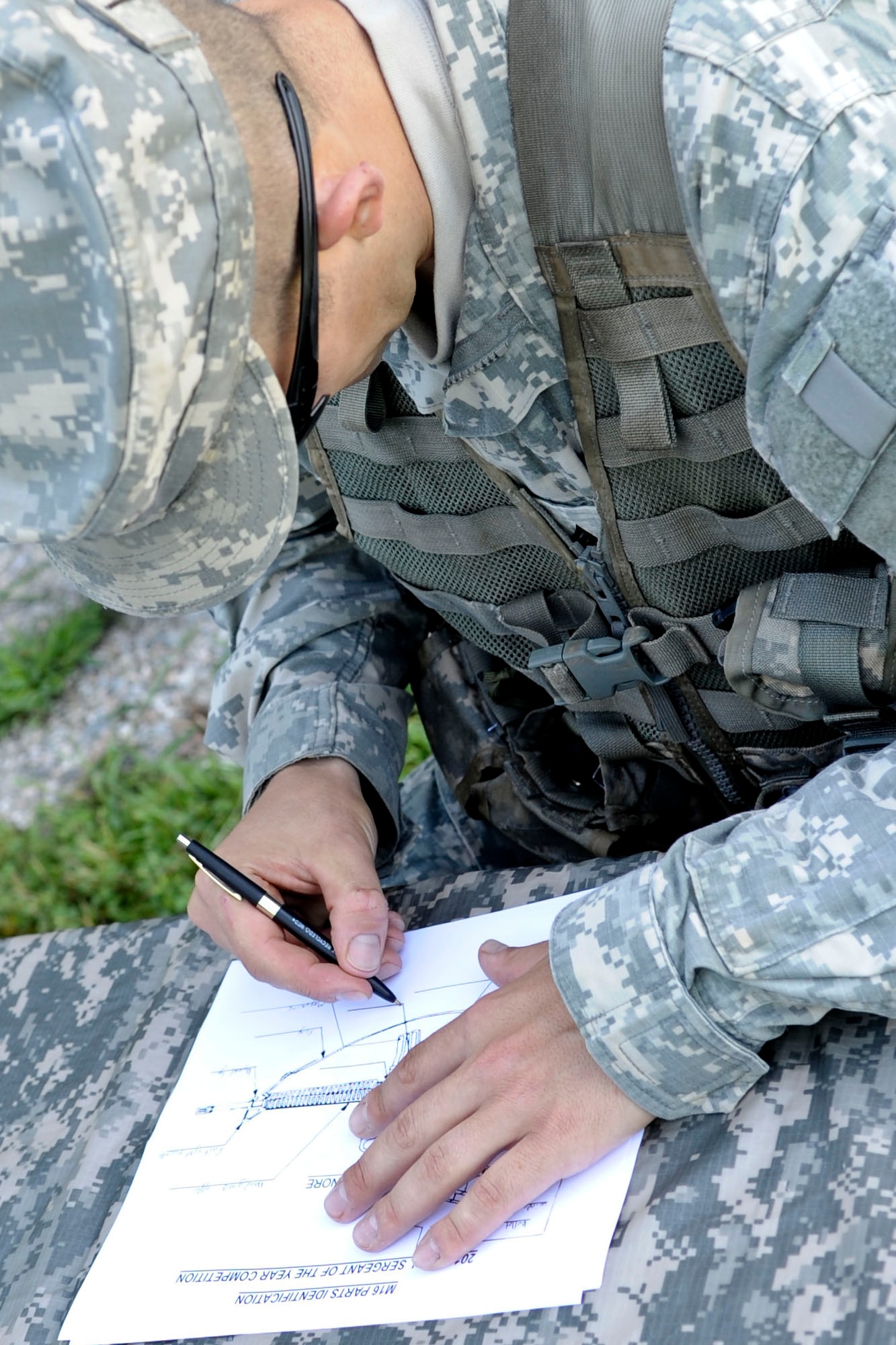 U.S. Army Staff Sgt. Jeffrey Heilman, Fort Jackson, S.C., drill sergeant, takes a test in which he has to name each part of an M-16 rifle during an event as part of the annual Drill Sergeant of the Year event, hosted by Initial Military Training, U.S. Army Training and Doctrine Command, June 26, 2012, at Fort Eustis, Va. During the event six drill sergeants competed in a variety of mental and physical event for the title of Drill Sergeant of the Year. (U.S. Air Force photo by Senior Airman Wesley Farnsworth/Released)