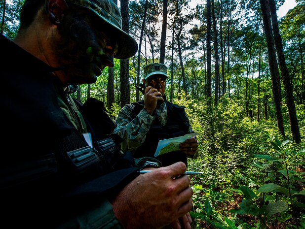 U.S. Air Force Capt. Elliot Riling, 15th Airlift Squadron, 437th Airlift Wing pilot, performs a radio check during Survival, Evasion, Resistance and Escape Combat Survival Training at Joint Base Charleston - Weapons Station, S.C., June 21, 2012. The 437th Operations Support Squadron conducts the training which is designed for aircrews and other personnel to implement survival techniques to evade enemy forces and to signal friendly forces. (U.S. Air Force photo by Airman 1st Class George Goslin/Released)