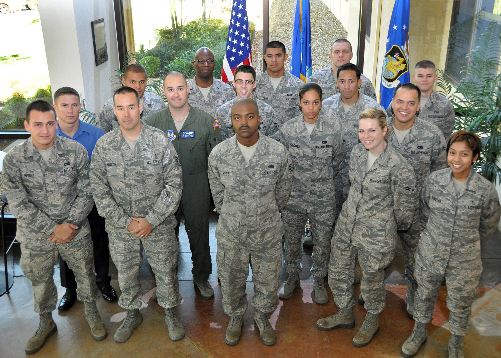 TRAVIS AIR FORCE BASE, Calif. -- New members of the 349th Air Mobility Wing pose for a photo during their in-processing to the unit June 24, 2012, at Travis Air Force Base, Calif(U.S. Air Force Photo / Master Sgt. Robert Wade)
