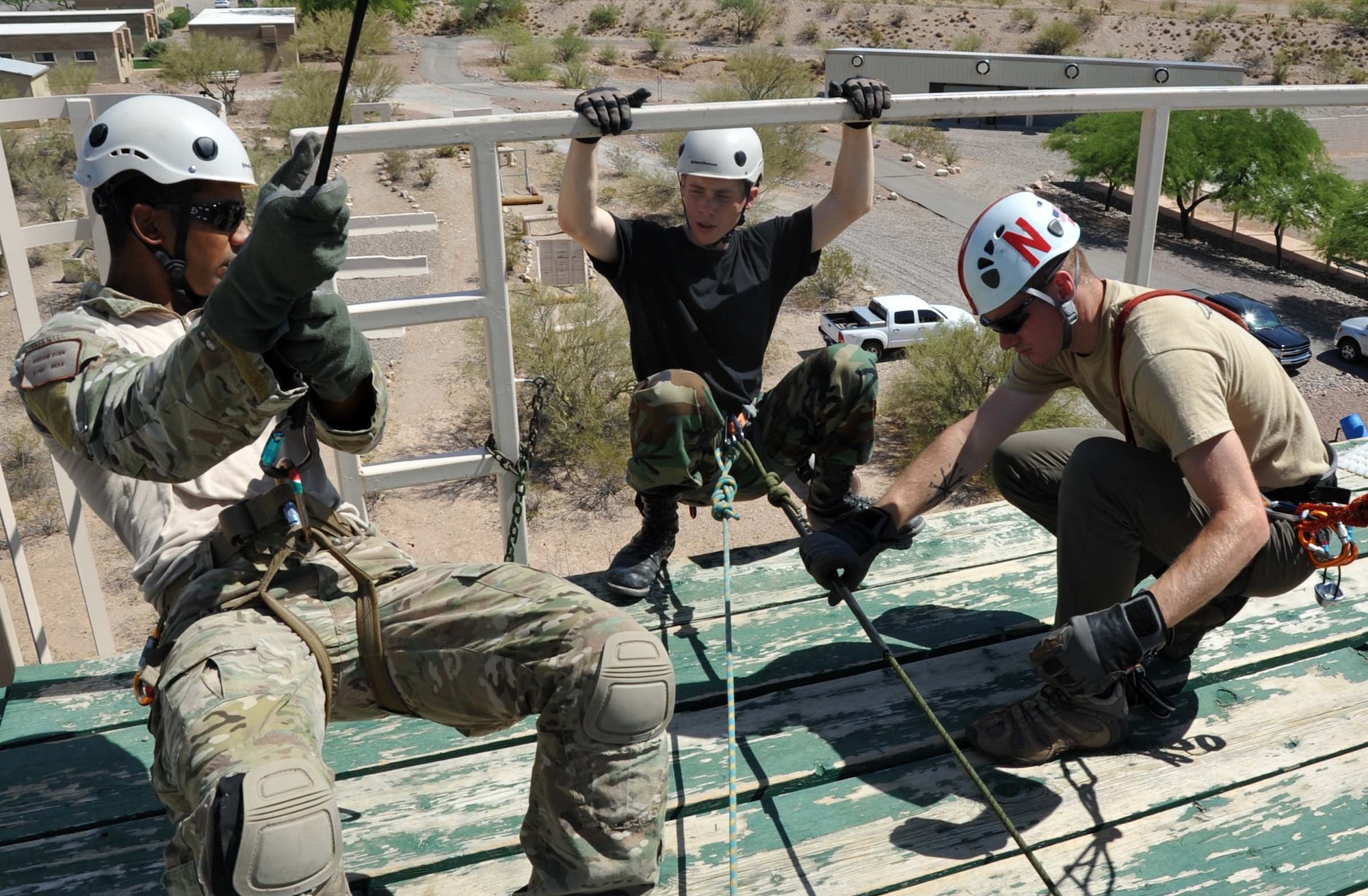 Staff Sgt. Richard Dunn, pararescueman with the 306th Rescue Squadron provided instruction on proper repelling techniques to Civil Air Patrol Cadets at the Pima County Rescue Training Center as part of the Advanced Pararescue Orientation Couse, a 10 day course that introduces CAP cadets to the operational PJ career field. (U.S. Air Force photo/ Master Sgt. Luke Johnson)