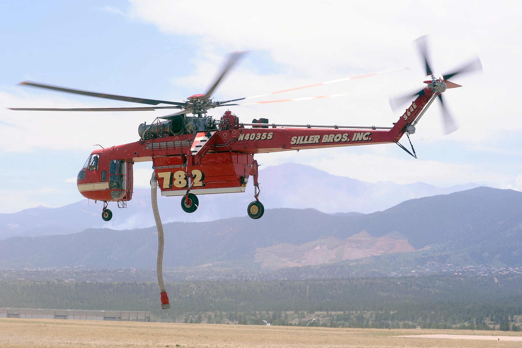 A Siller Brothers firefighting helicopter takes off from the Air Force Academy airfield to fight the Waldo Canyon fire June 25, 2012. The Academy canceled its normal flying operations June 23 to facilitate helicopter operations. (U.S. Air Force photo/Mike Kaplan)