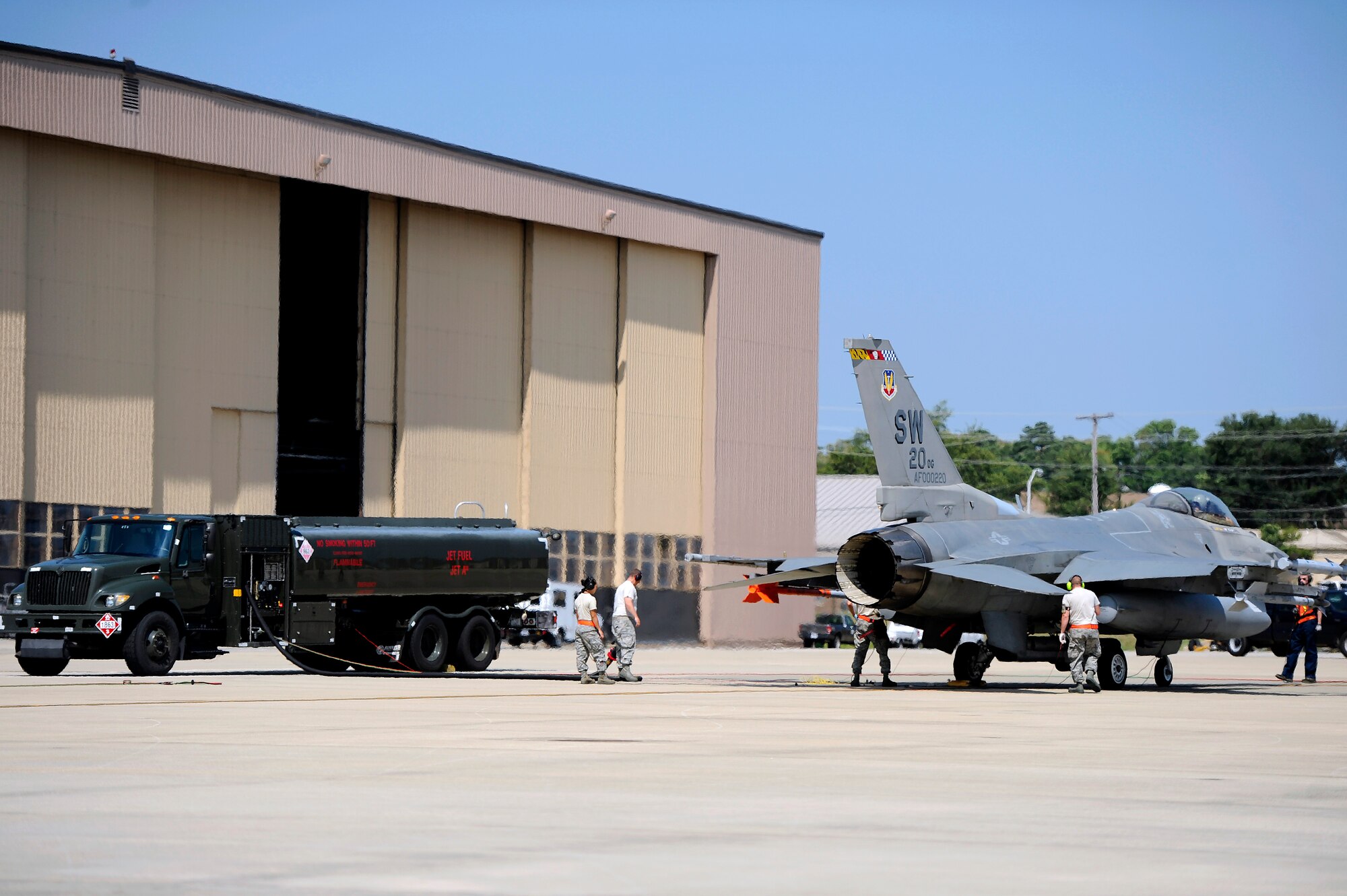Airmen from the 20th Aircraft Maintenance Squadron and 20th Logistics Readiness Squadron supply fuel to F-16 at Shaw Air Force Base, S.C., June 26, 2012. Ensuring jets are maintained, fueled and ready to fly bolsters mission success. (U.S. Air Force photo by Senior Airman Kenny Holston/Released)