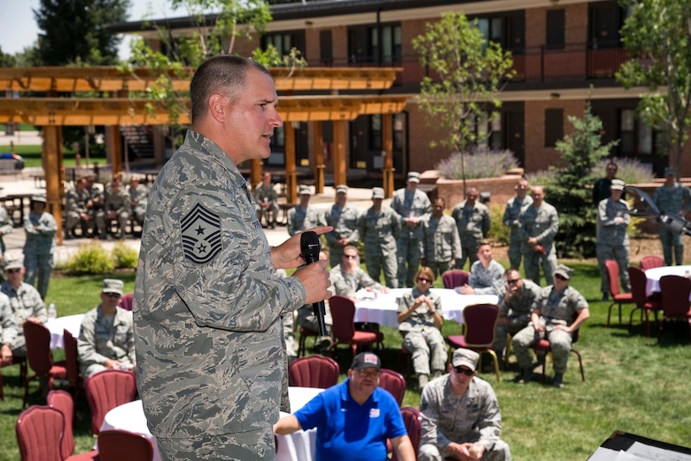 PETERSON AIR FORCE BASE, Colo. - Chief Master Sgt. Thomas Trottier, 21st Space Wing command chief, bids farewell to Team Pete personnel during a going away luncheon in his honor June 19, 2012. Scores of 21st SW personnel attended to thank Trottier for his leadership while stationed at Peterson Air Force Base. Trottier is moving to Seymour Johnson Air Force Base, N.C. (U.S. Air Force photo/Craig Denton)