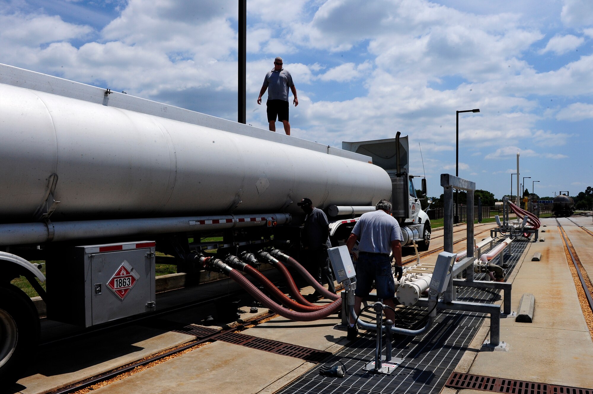 Civilian contractors transport and unload fuel supplies at Shaw Air Force Base, S.C., June 26, 2012. The ability to transport and receive fuel is essential for mission success. (U.S. Air Force photo by Airman 1st Class Daniel Blackwell/Released)