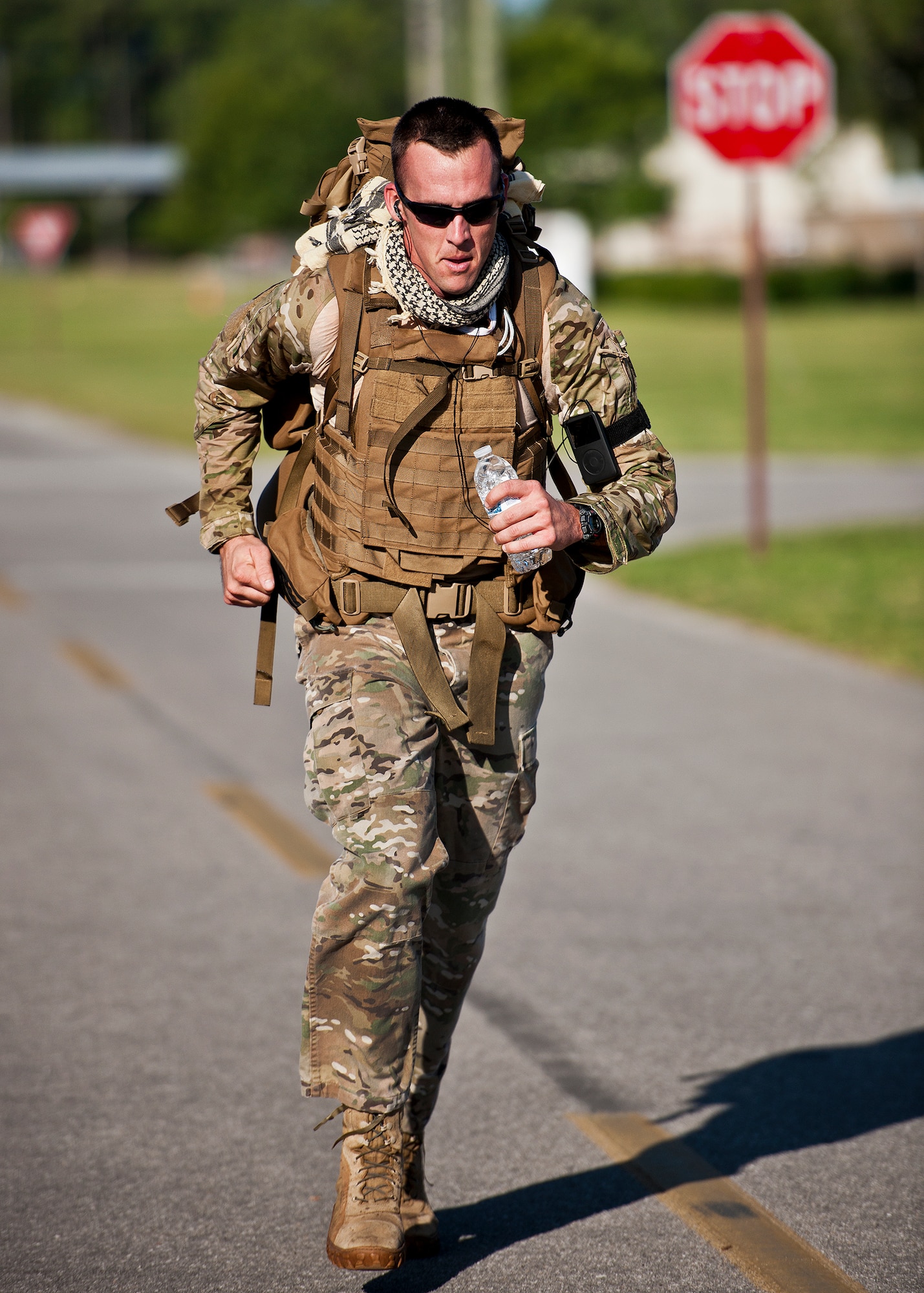 Staff Sgt. Michael Edwards, of the 96th Civil Engineer Squadron, completes the 5K run in a flak jacket and backpack June 26 at Eglin Air Force Base, Fla.  More than 50 runners turned out for the run to honor and remember Tech. Sgt. Daniel Douville, an explosive ordnance disposal Airman from Eglin, who was killed in Afghanistan.  The run, which was led by the 96th EOD flight, marked the one year anniversary of his death.  Douville’s name was added to the EOD Memorial Wall earlier this year.  (U.S. Air Force photo/Samuel King Jr.)