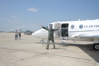 Col. Richard Murphy, 12th Flying Training Wing commander, gets drenched afer completing his final flight as commander in a T-1 Jayhawk aircraft on Joint Base San Antonio-Randolph, Texas, June 25. (U.S. Air Force photo by Rich McFadden) 