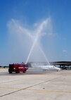 Col. Richard Murphy, 12th Flying Training Wing commander, gets drenched after completing his final flight as commander in a T-1 Jayhawk aircraft on Joint Base San Antonio-Randolph, Texas, June 25. (U.S. Air Force photo by Melissa Peterson)