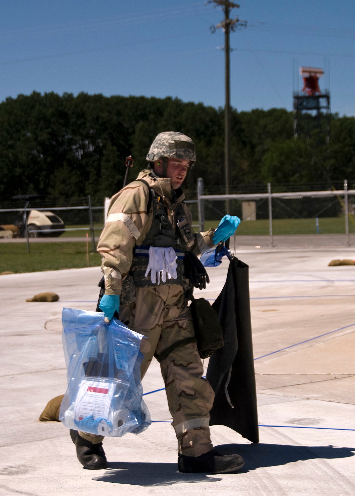 Senior Airman Samuel Wirstrom, 137th Air Refueling Wing Petroleum, Oil and Lubricant flight collects samples to test in the laboratory while deployed to Alpena, Mich. June 13, 2012.  The 137th, 459th and 507 Air Refueling Wings united for an Operational Readiness Inspection at the 124th Air Expeditionary Wing.  (USAF Photo by Tech. Sgt. Roberta A. Thompson)