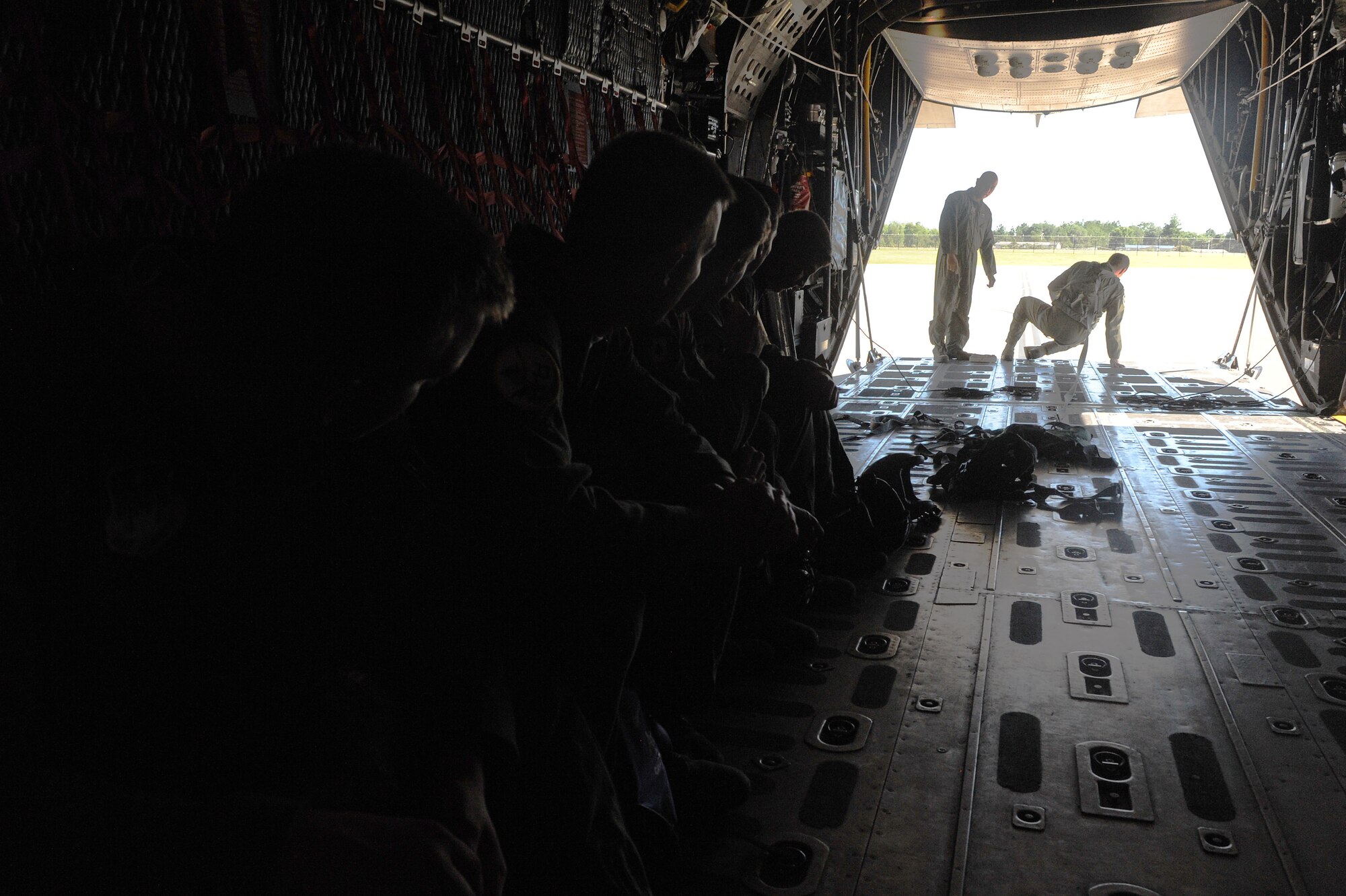 U.S. Air Force Academy cadets watch as security procedures are explained while in an HC-130P Combat King at Moody Air Force Base, Ga., June 19, 2012. Groups of cadets are visiting Moody throughout the summer to get a taste of Air Force careers and the military lifestyle. (U.S. Air Force photo by Staff Sgt. Ciara Wymbs/Released) 

