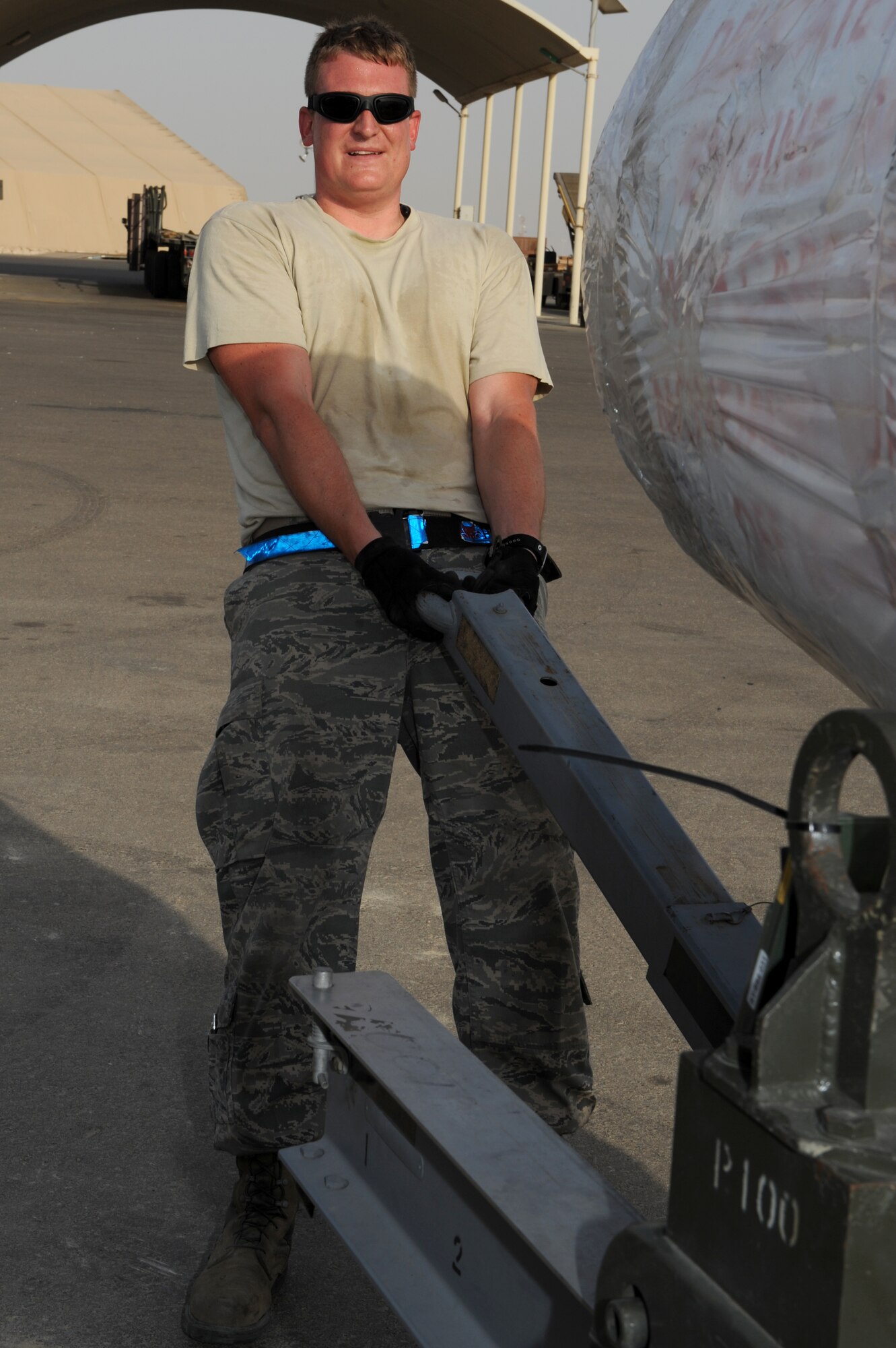 SOUTHWEST ASIA - Tech. Sgt. Mark Taylor, 380th Expeditionary Logistics Readiness Squadron Air Terminal Operations Center supervisor, pulls an aircraft engine June 26, 2012. Taylor is deployed to the 380th Air Expeditionary Wing from Joint Base Andrews, Md. (U.S. Air Force photo/Master Sgt. Scott MacKay)