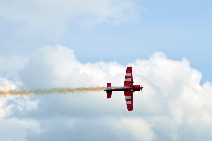 BITBURG, Germany – A stunt plane performs a barrel roll for spectators during Aviation Expo Europe here June 23. The annual expo features multiple aerial demonstrations and an aircraft sales and showcase floor. More than 5,000 exhibitors, vendors and visitors attended the three-day event. This year’s expo included its first showcase of an A-10 aircraft at the new location at the Bitburg Airport. (U.S. Air Force photo by Airman 1st Class Dillon Davis/Released)